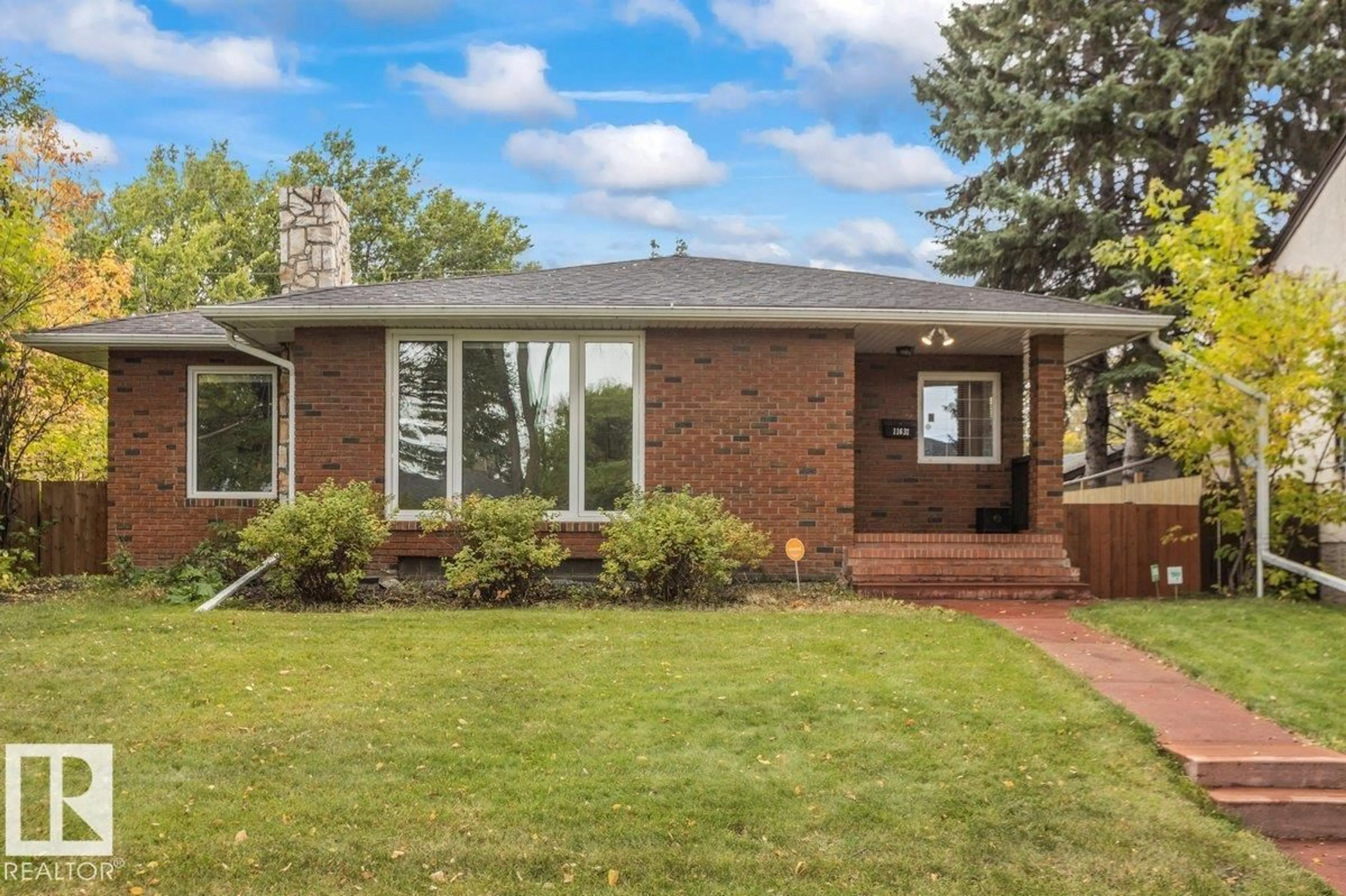 Home with brick exterior material, street for 11631 130 ST, Edmonton Alberta T5M1A7