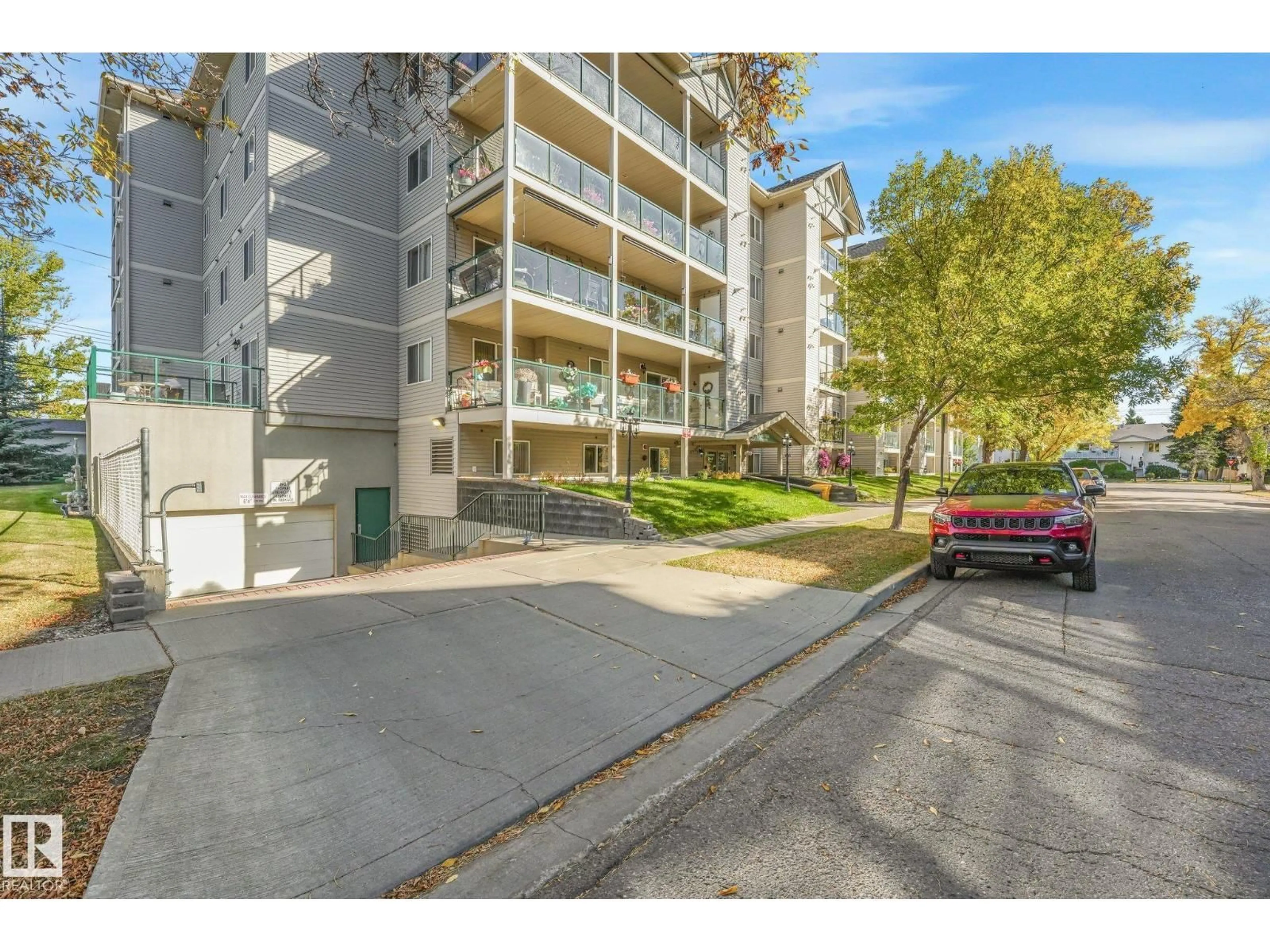 A pic from outside/outdoor area/front of a property/back of a property/a pic from drone, street for 310 - 4806 48 AV, Leduc Alberta T9E8S2