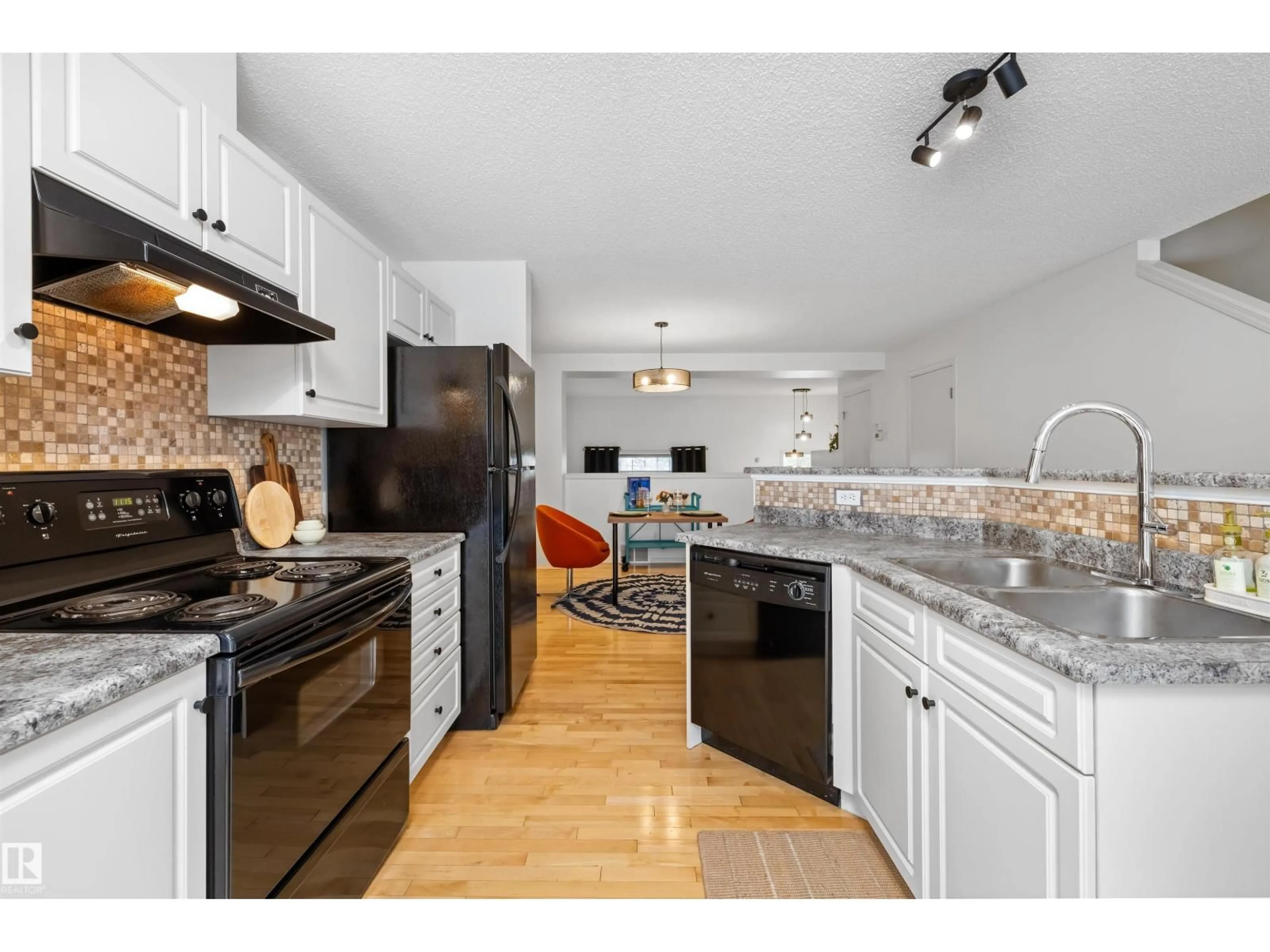 Open concept kitchen, unknown for #83 - 8304 11 AV, Edmonton Alberta T6X1J8