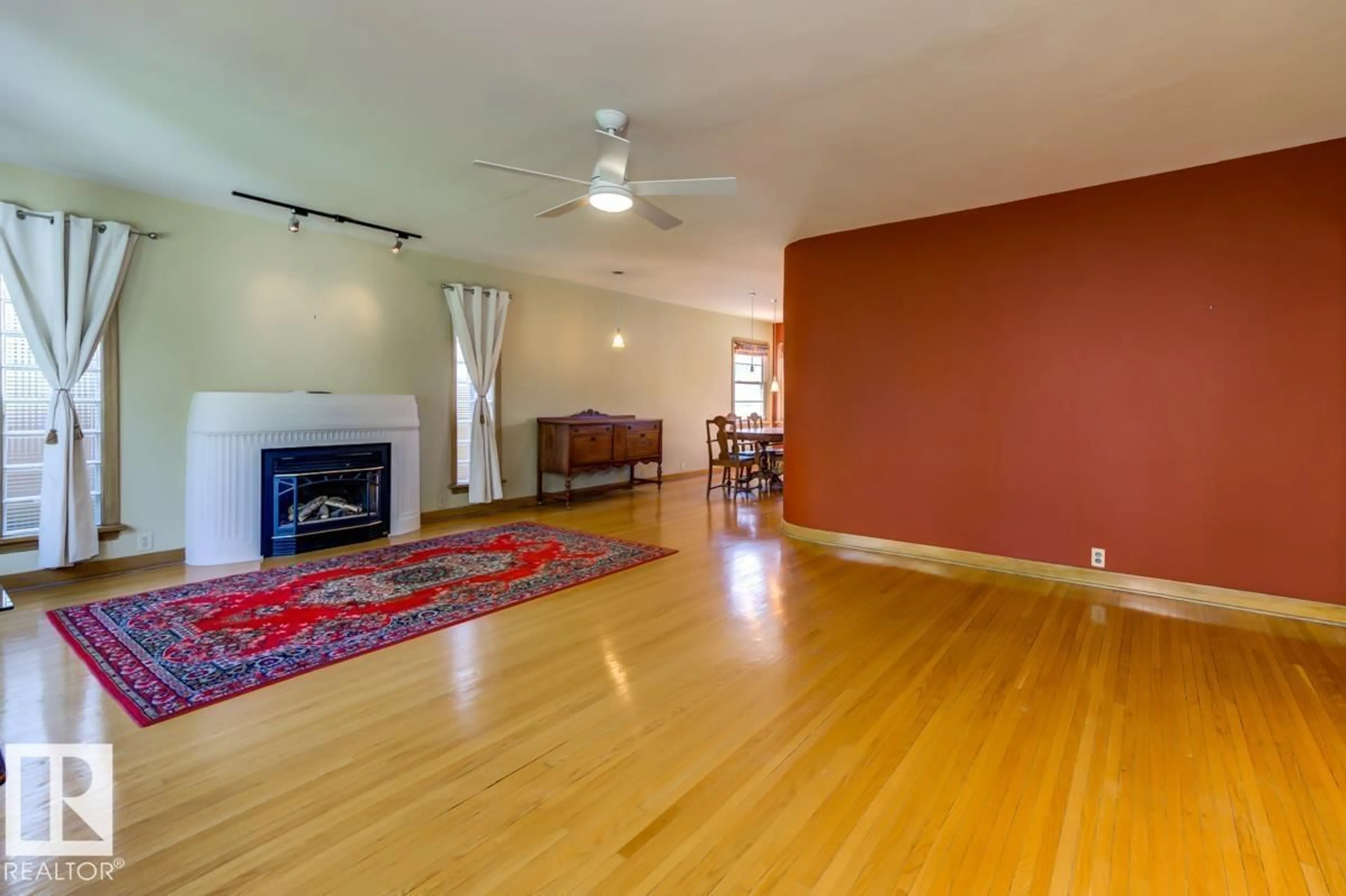 Living room with furniture, wood/laminate floor for 10514 127 STREET STREET, Edmonton Alberta T5N1V9