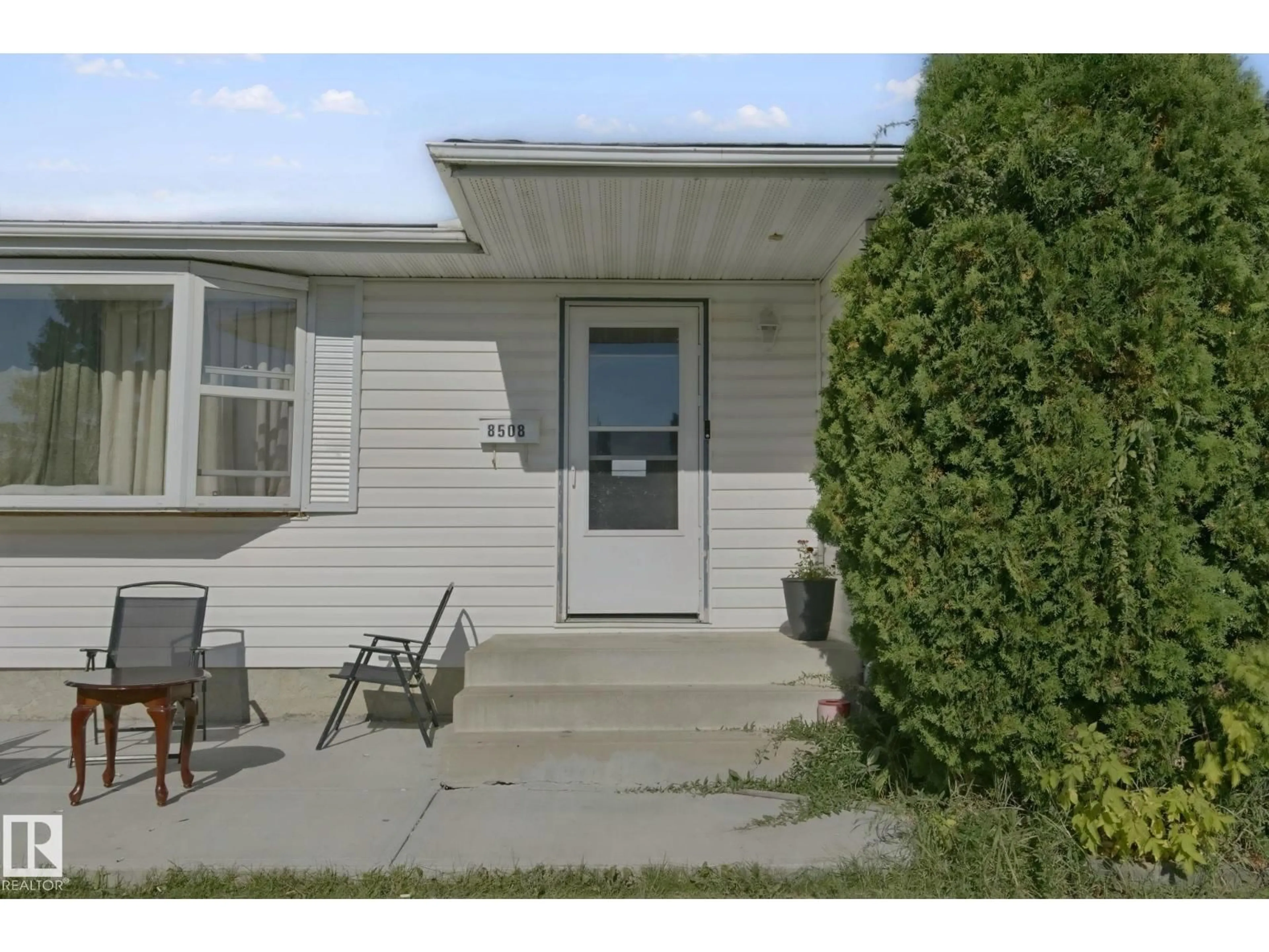 Home with vinyl exterior material, street for 8508 149A AV, Edmonton Alberta T5E2Z2
