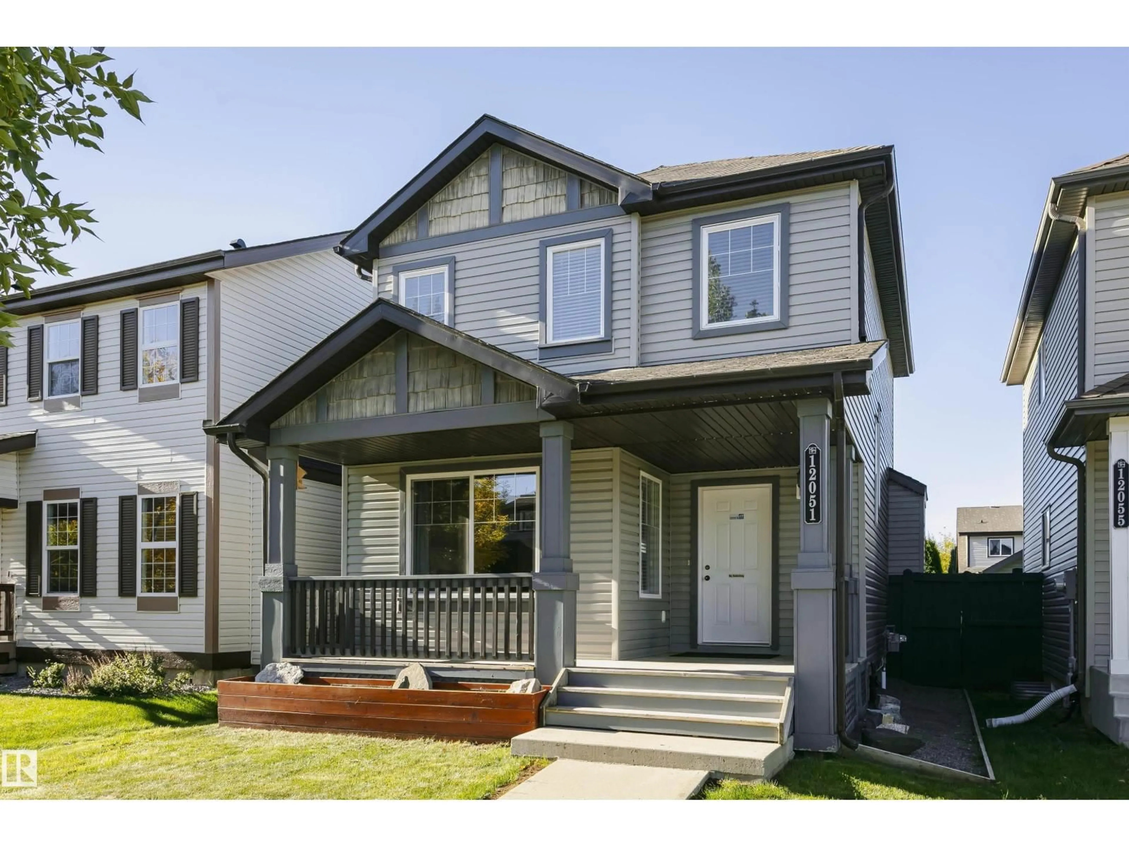 Home with vinyl exterior material, street for SW - 12051 18 AV, Edmonton Alberta T6W1W3