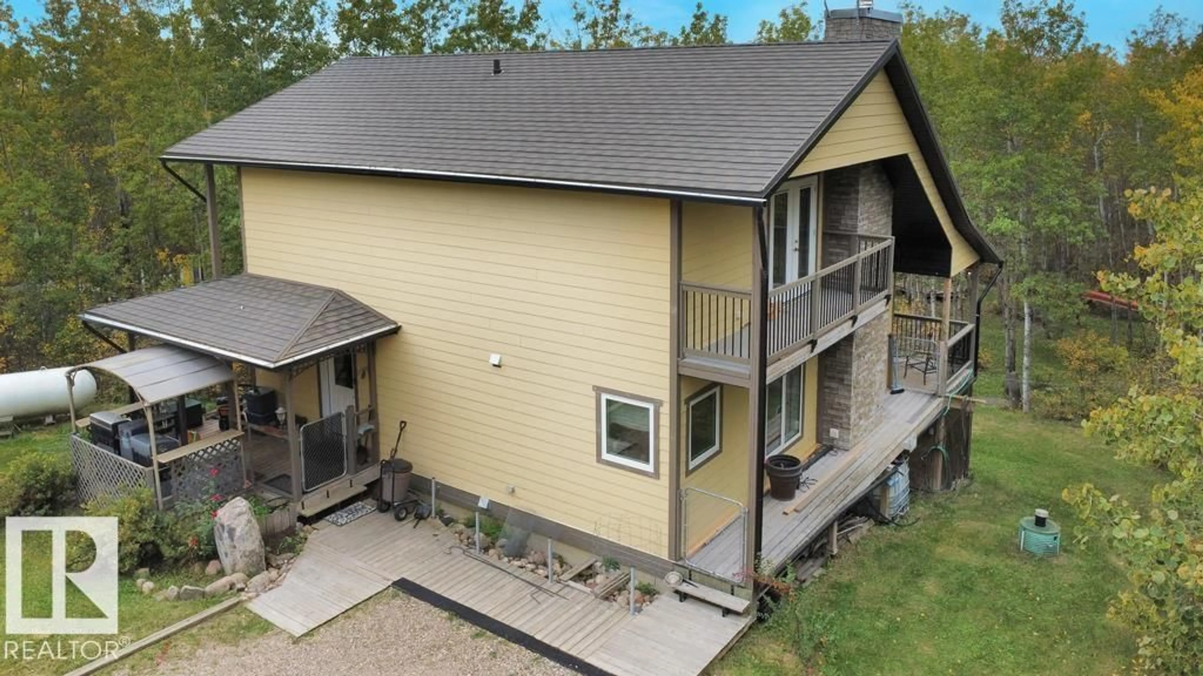 A pic from outside/outdoor area/front of a property/back of a property/a pic from drone, building for #222 / 220 - 58532 RGE RD 113, Rural St. Paul County Alberta T0A0C0