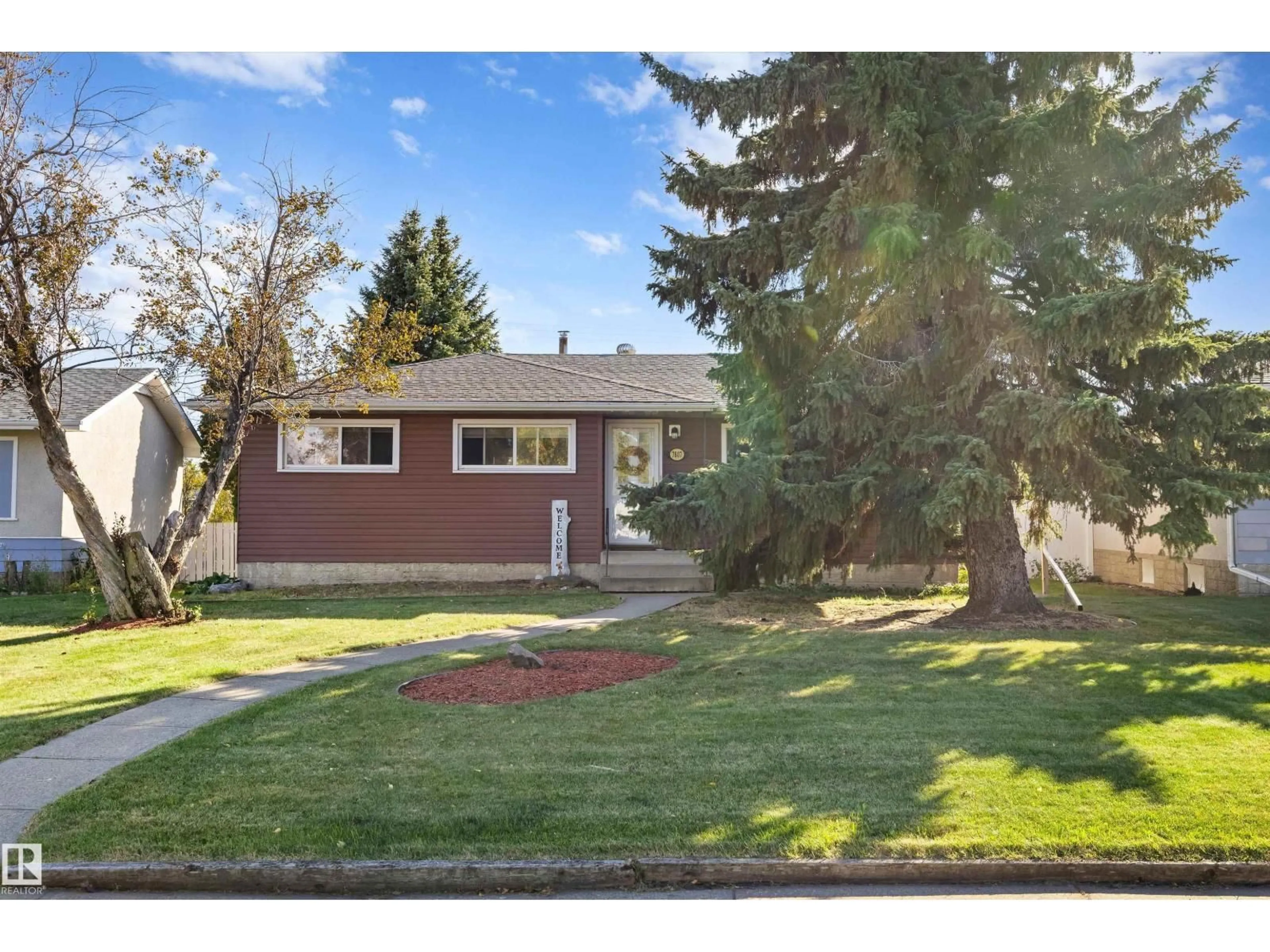 Home with vinyl exterior material, street for 7807 134 AV, Edmonton Alberta T5C2G2
