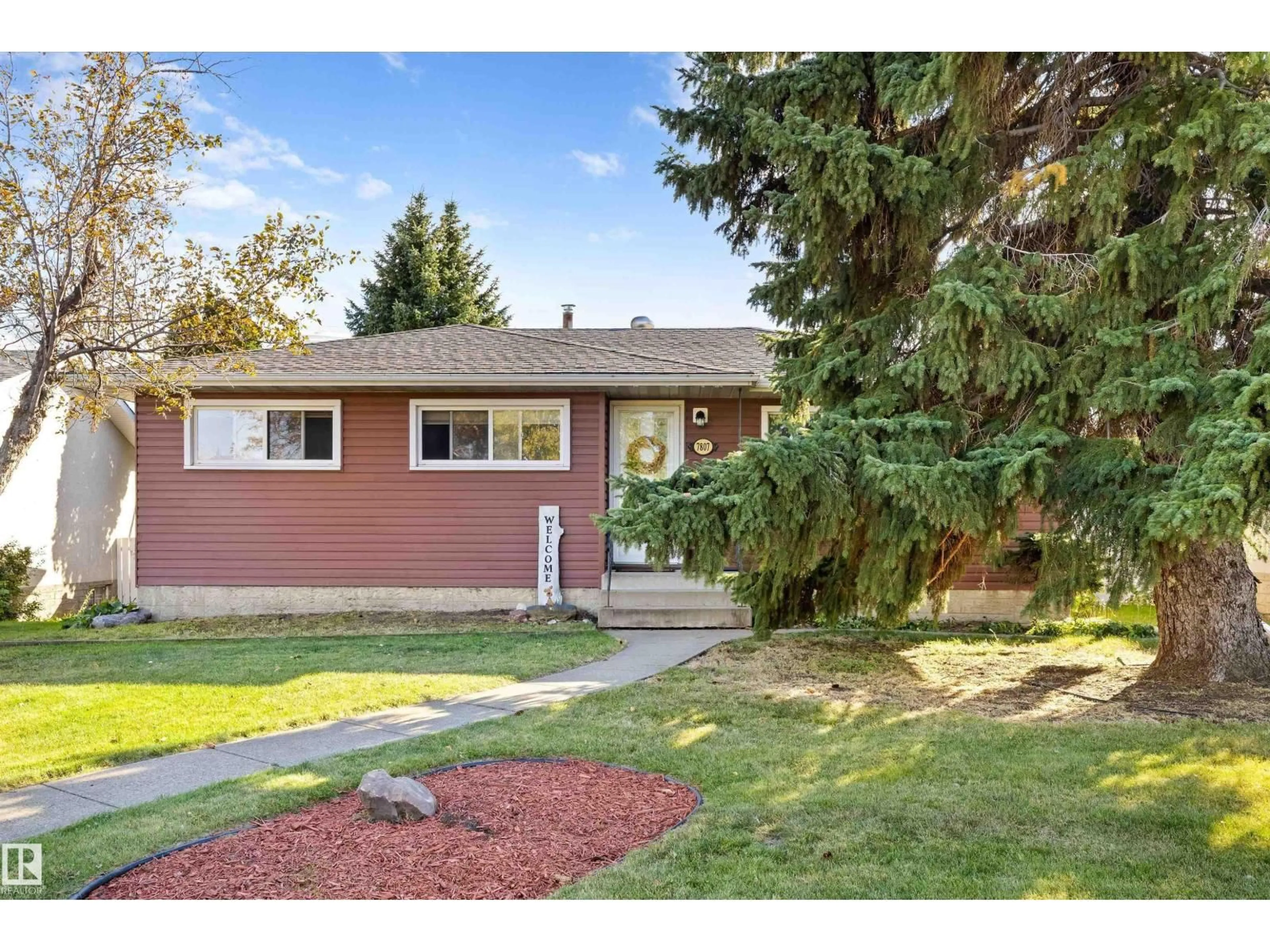Home with vinyl exterior material, street for 7807 134 AV, Edmonton Alberta T5C2G2