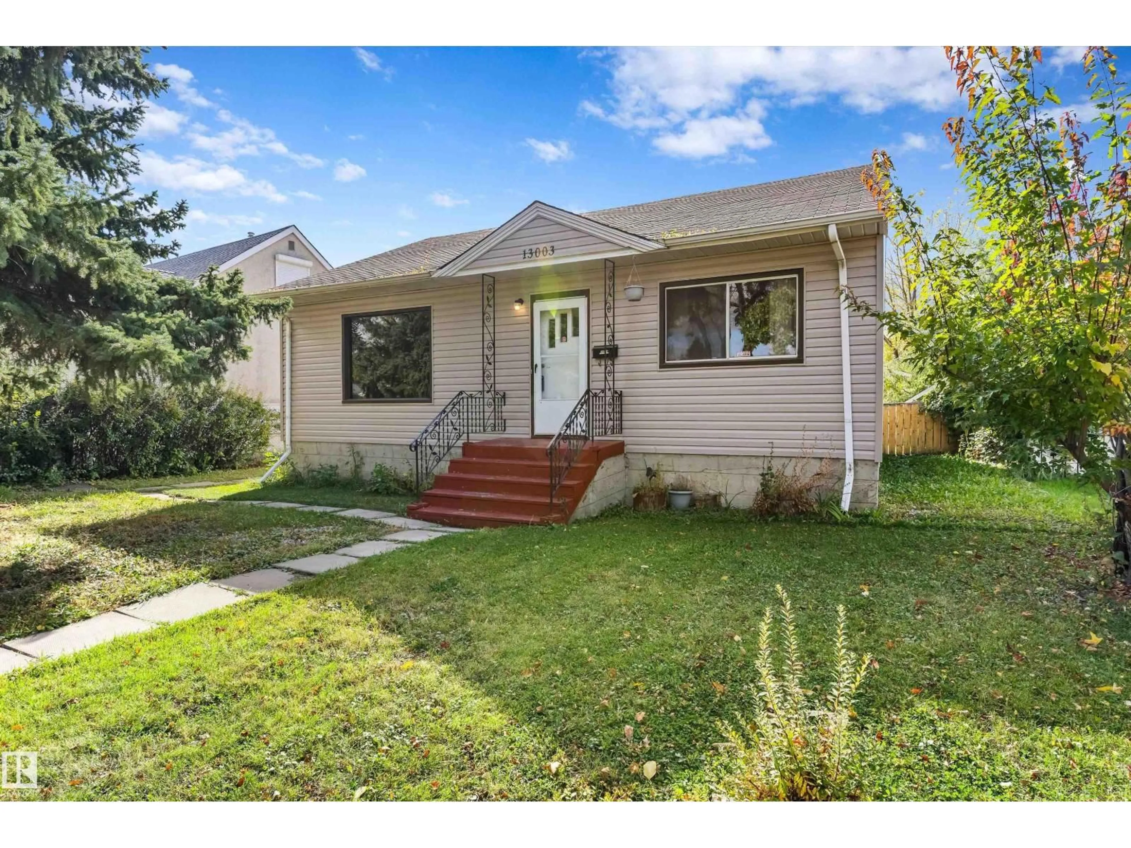 Home with vinyl exterior material, street for 13003 SHERBROOKE AV NW, Edmonton Alberta T5L4E6