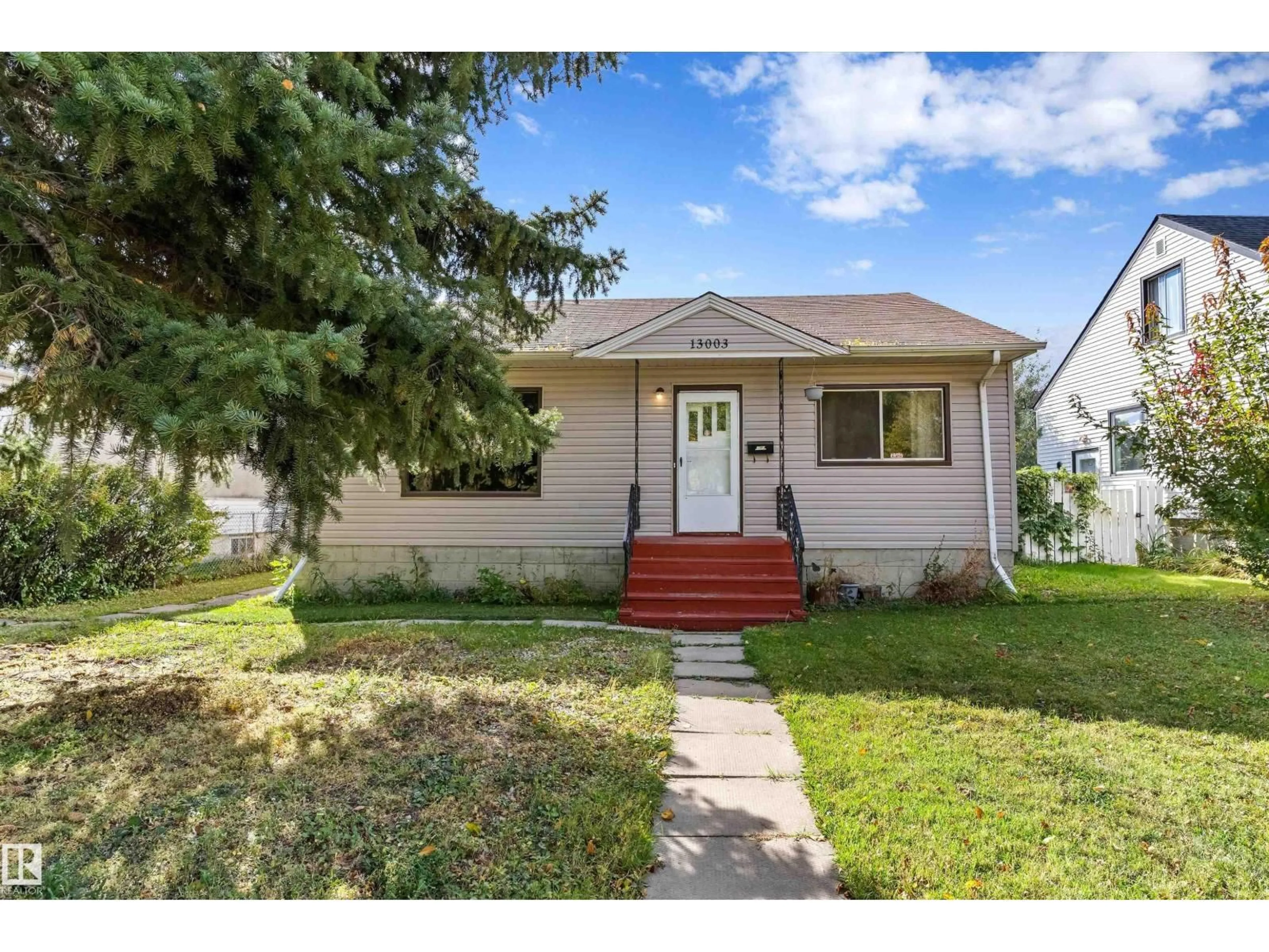 Home with vinyl exterior material, street for 13003 SHERBROOKE AV NW, Edmonton Alberta T5L4E6