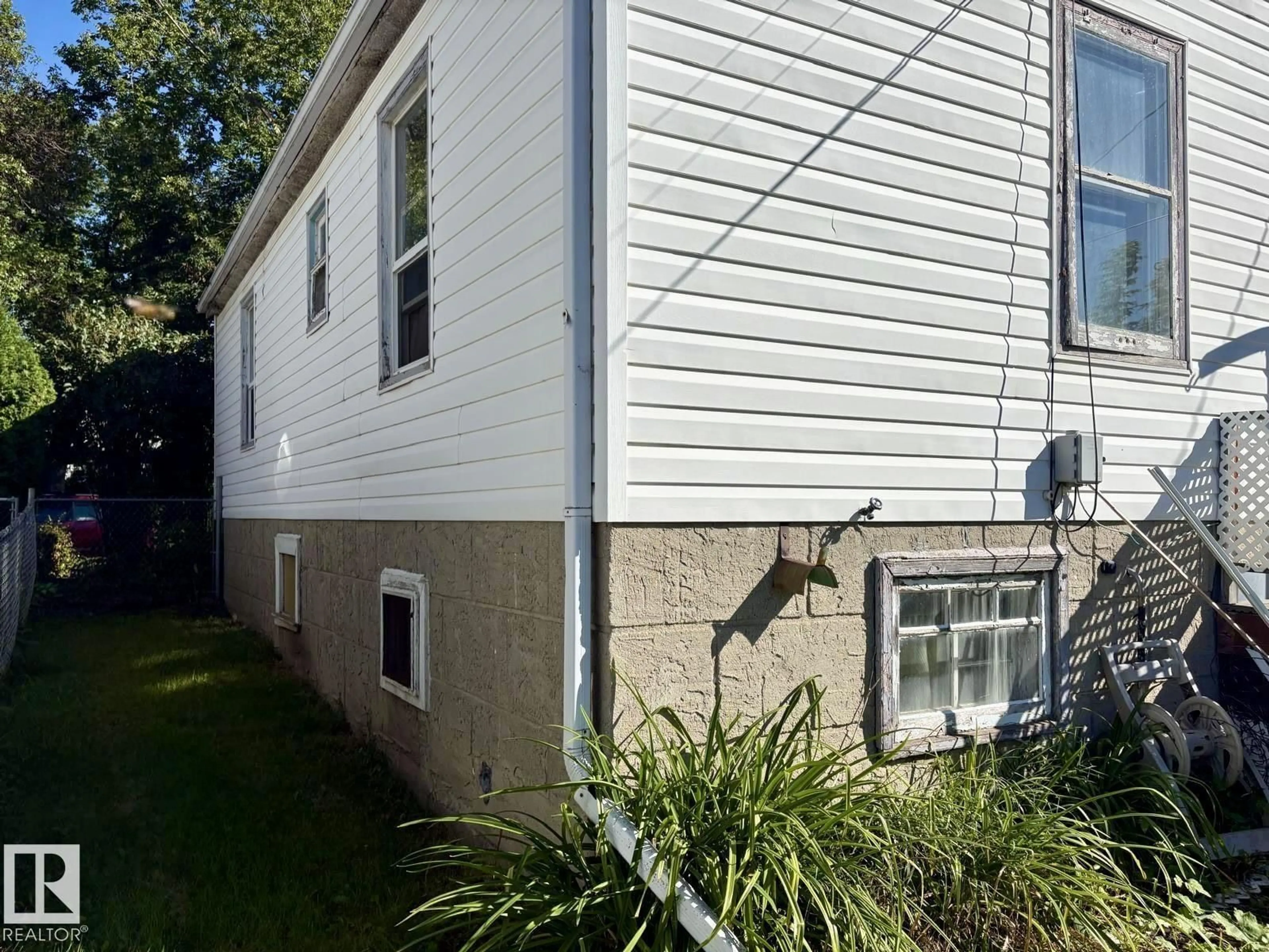 Home with vinyl exterior material, street for 11922 69 ST, Edmonton Alberta T5B1S5