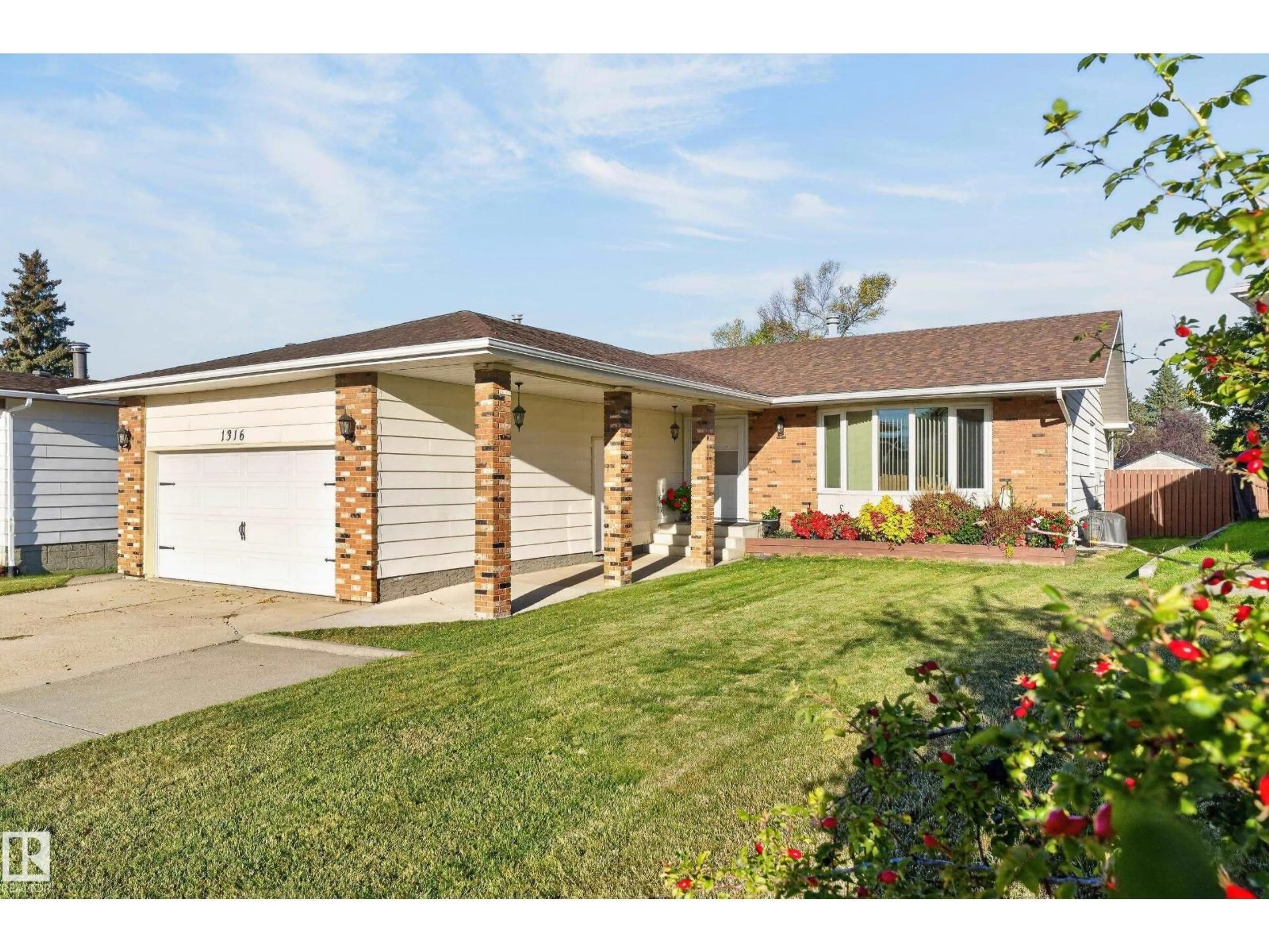 Home with brick exterior material, street for 1316 85 ST, Edmonton Alberta T6K1X8