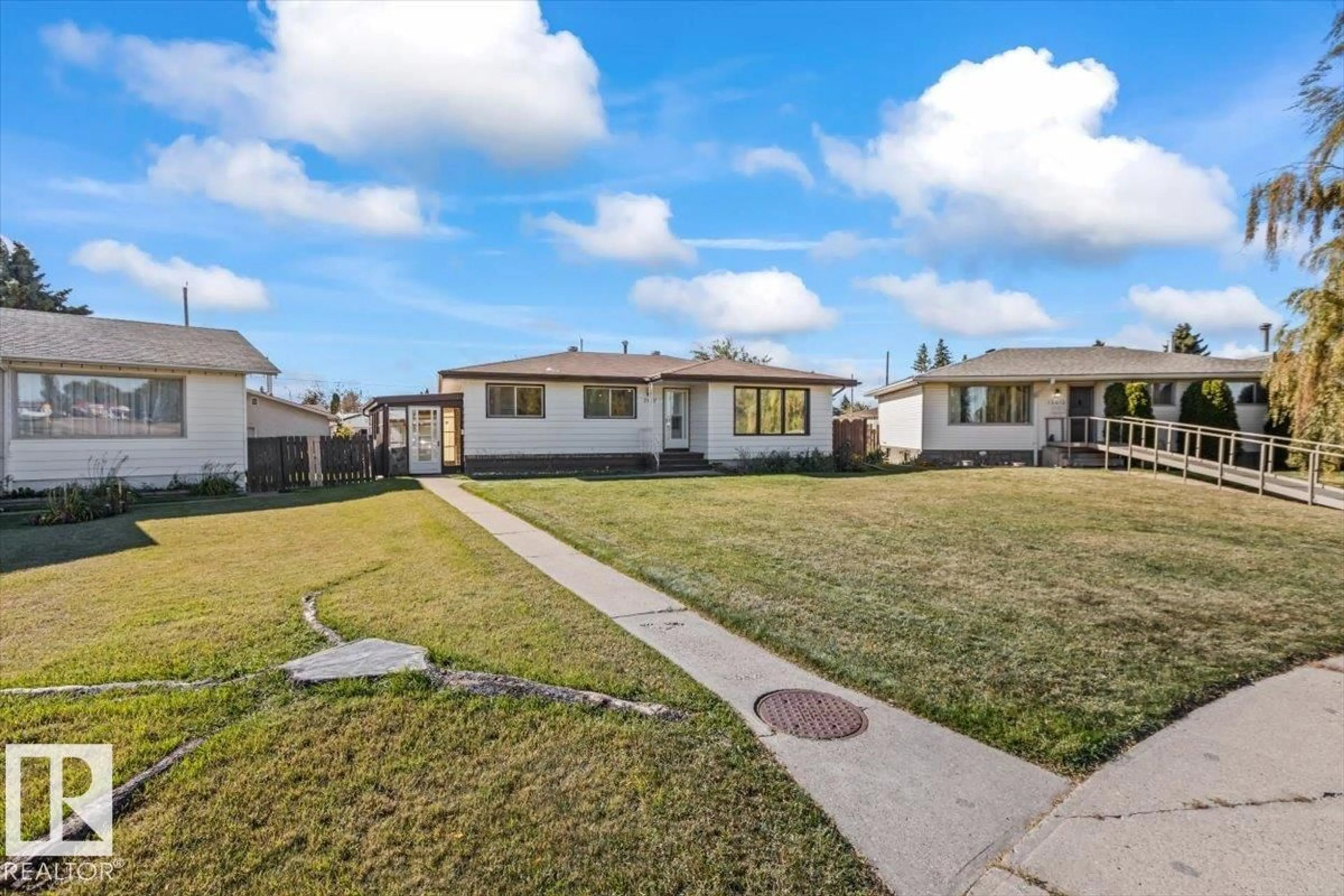 A pic from outside/outdoor area/front of a property/back of a property/a pic from drone, street for 7627 128A AV, Edmonton Alberta T5C1V1