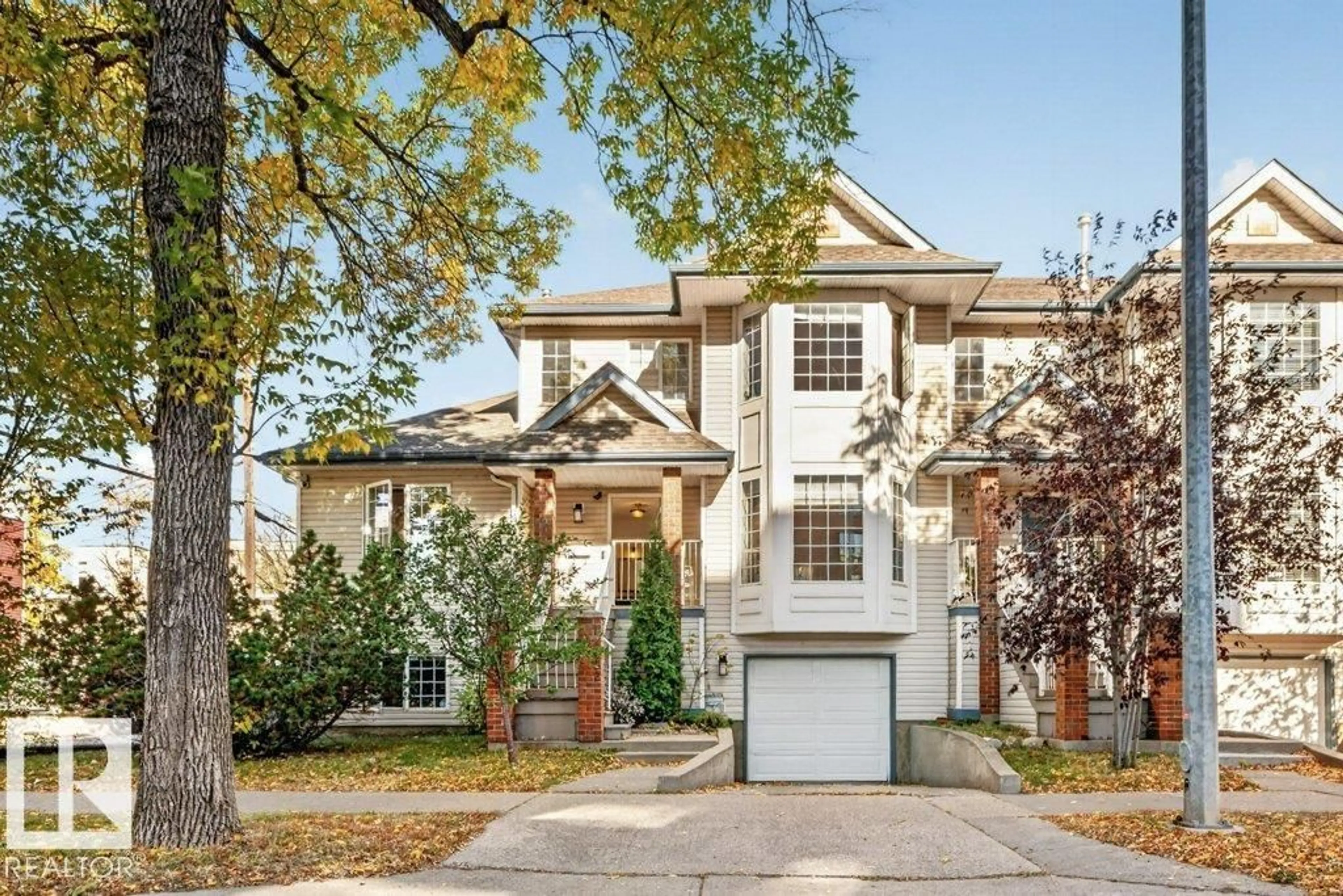 Home with brick exterior material, street for 11412 102 AV, Edmonton Alberta T5K0P9
