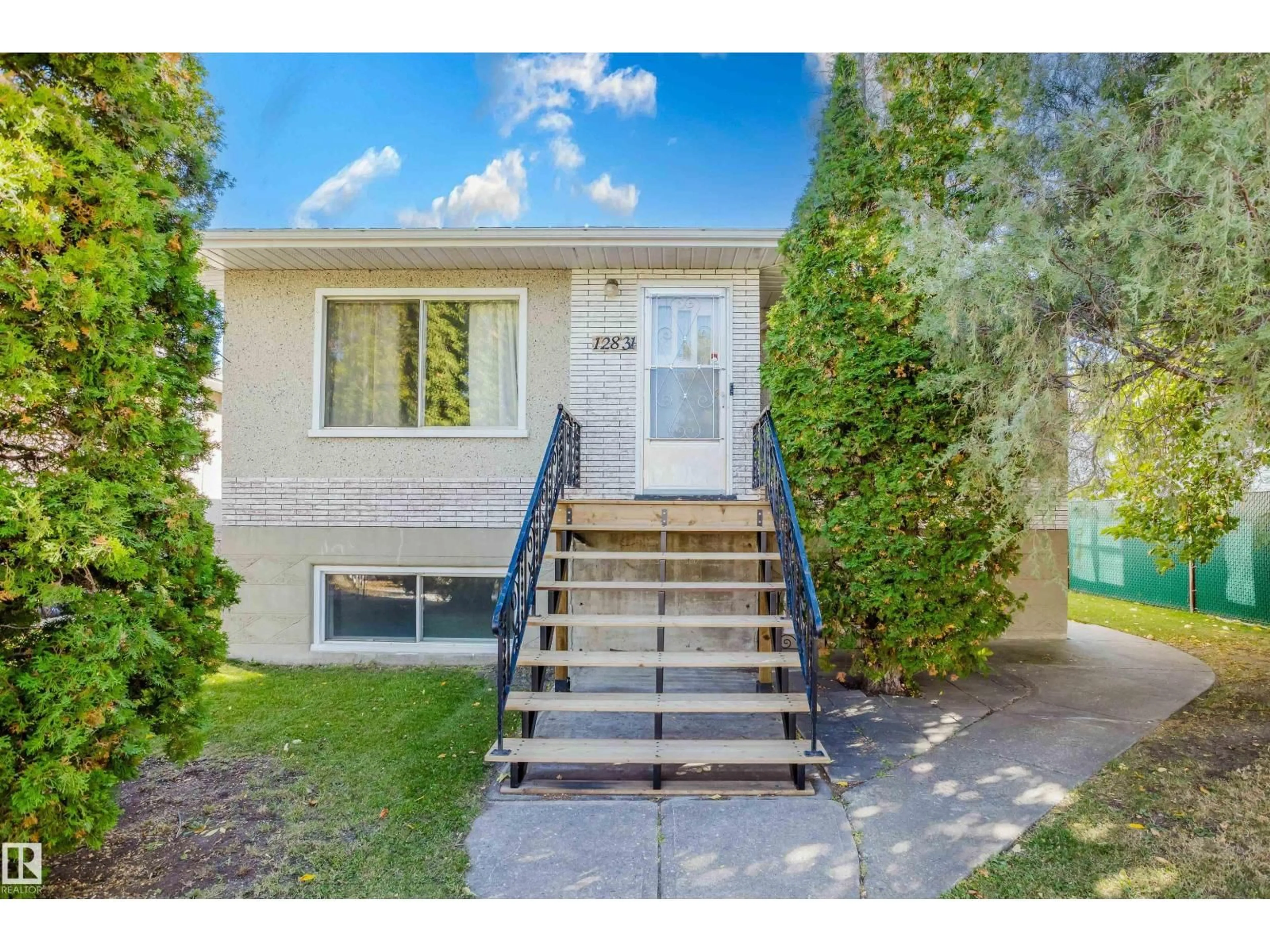 Home with vinyl exterior material, street for 12831 126 ST, Edmonton Alberta T5L0Y2