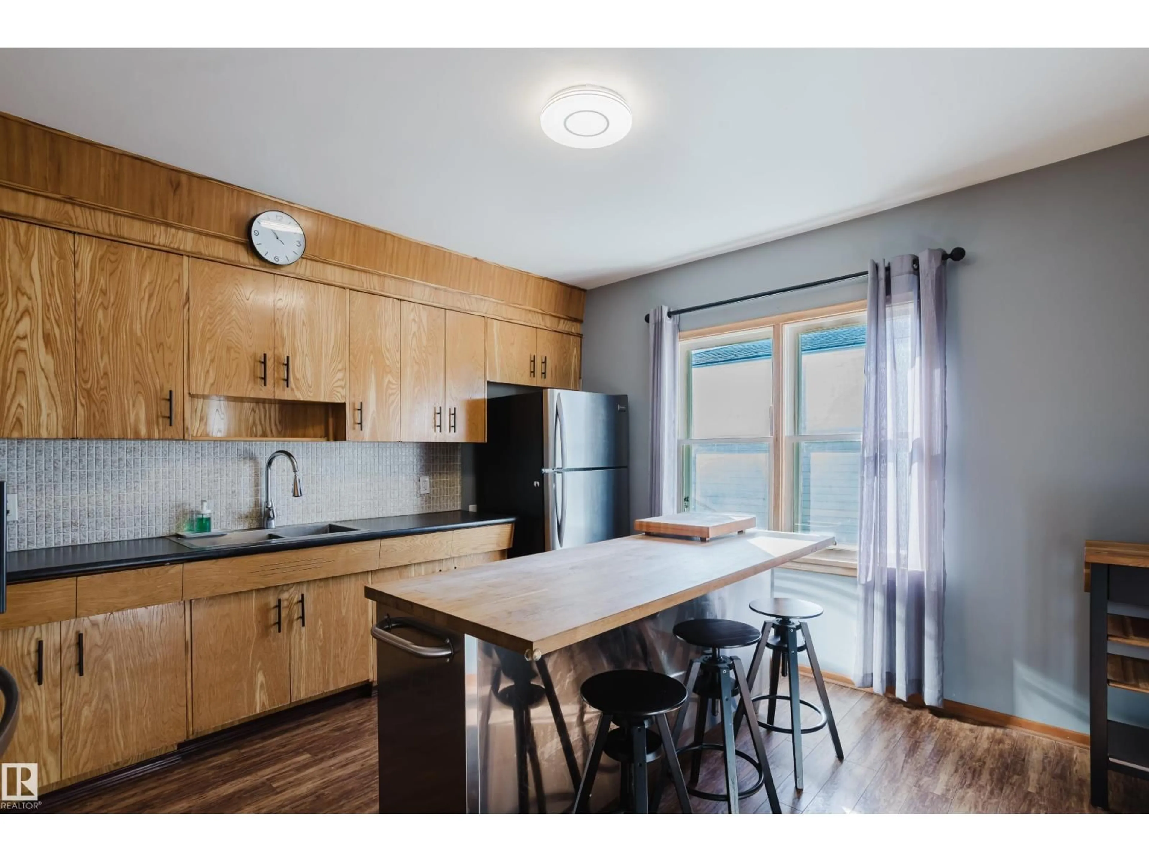 Open concept kitchen, wood/laminate floor for 12831 126 ST, Edmonton Alberta T5L0Y2