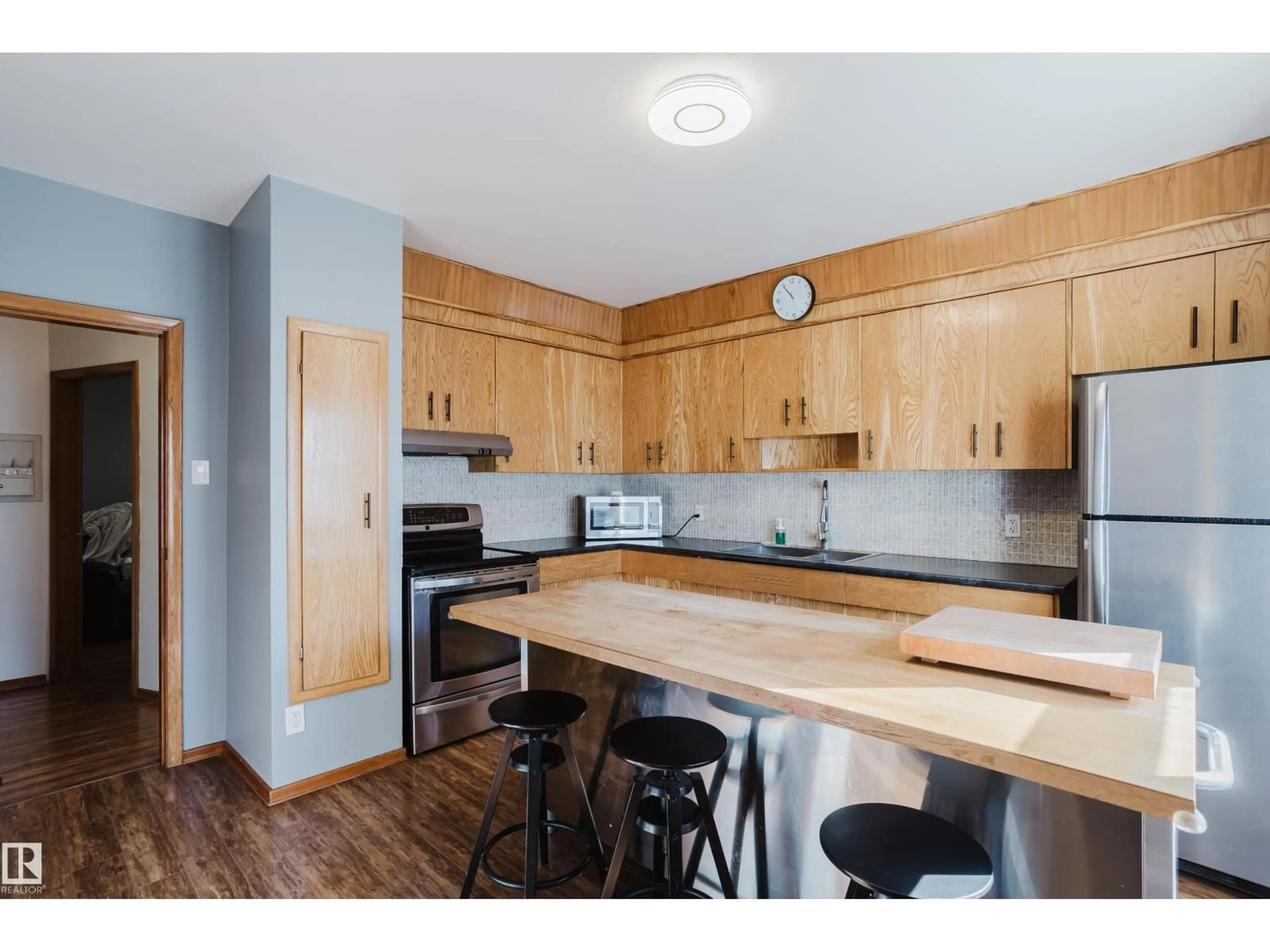 Open concept kitchen, wood/laminate floor for 12831 126 ST, Edmonton Alberta T5L0Y2