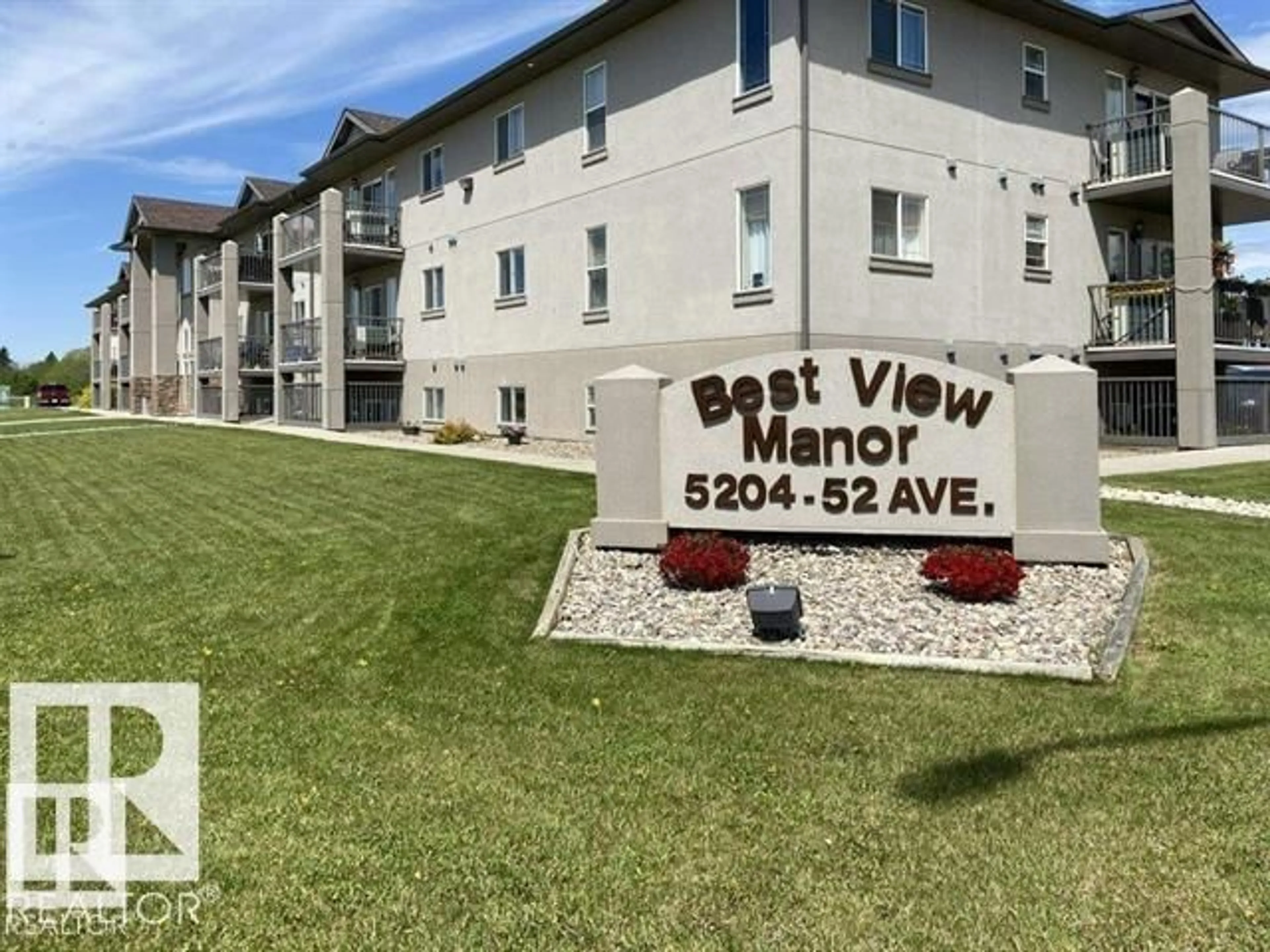 A pic from outside/outdoor area/front of a property/back of a property/a pic from drone, mountain view for 311 - 5204 52 AV, Tofield Alberta T7S1A3