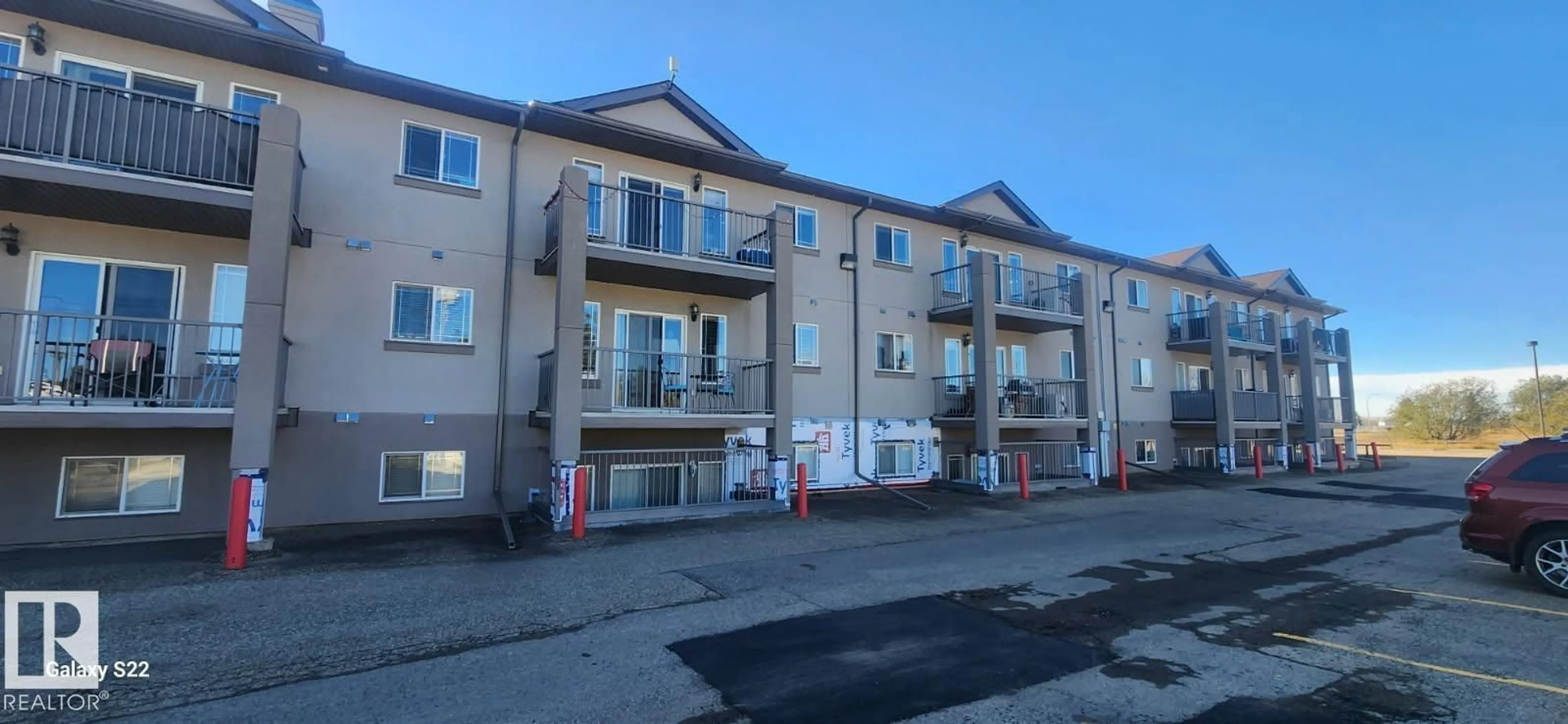 A pic from outside/outdoor area/front of a property/back of a property/a pic from drone, building for 311 - 5204 52 AV, Tofield Alberta T7S1A3