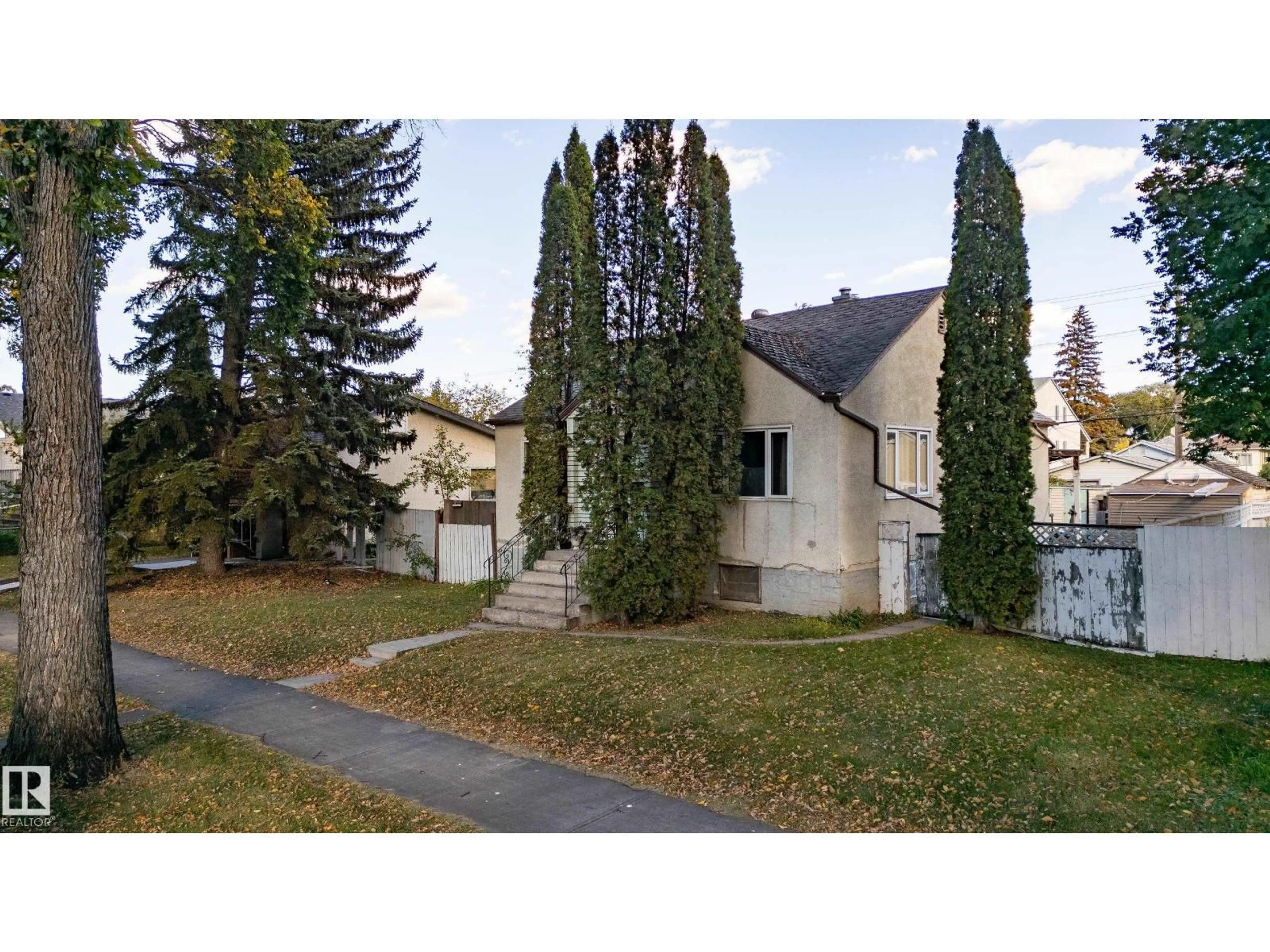 Home with vinyl exterior material, street for NW - 12023 67 ST, Edmonton Alberta T5B1M4