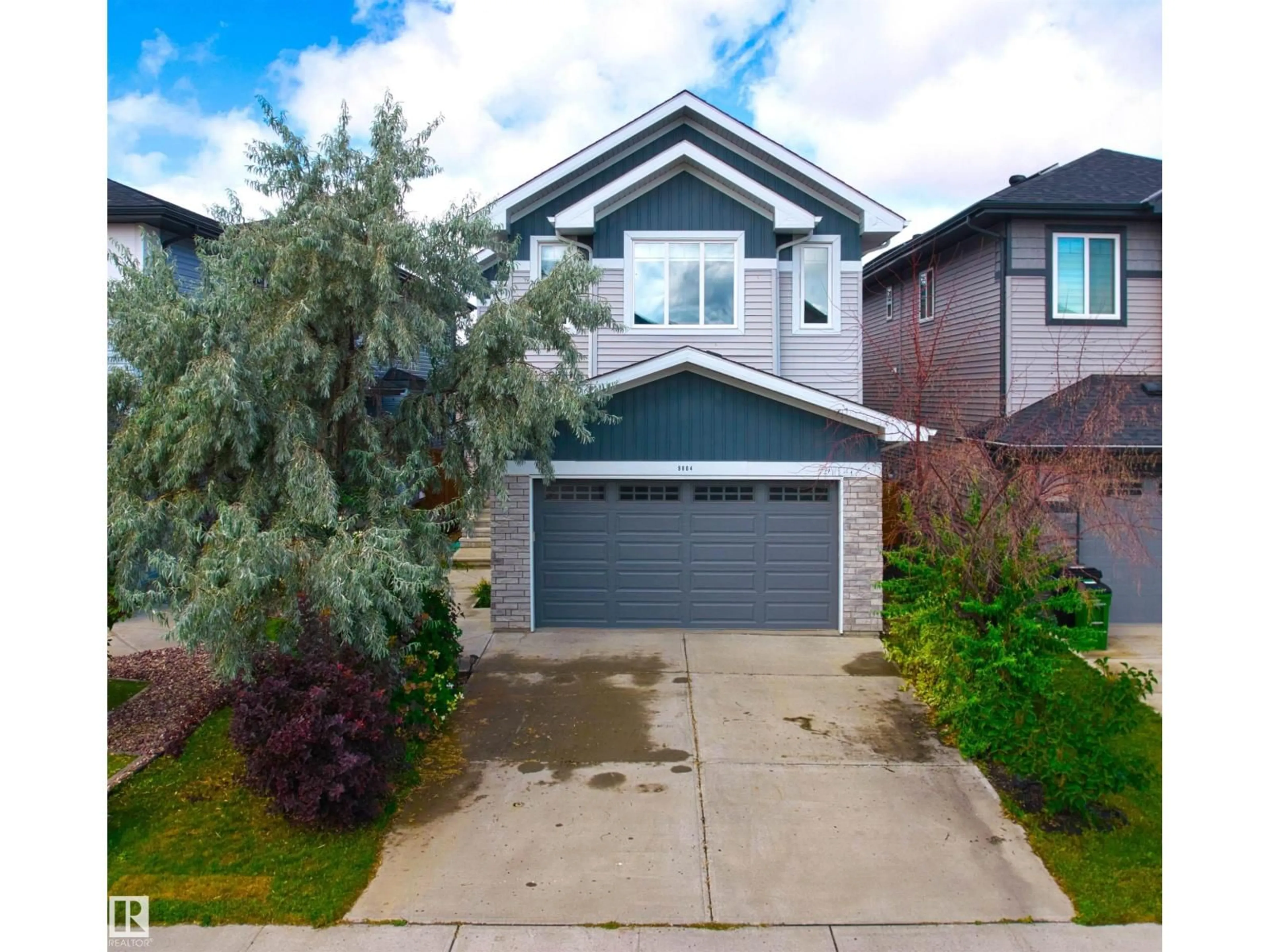 Home with vinyl exterior material, street for 9804 223 ST, Edmonton Alberta T5T7B6