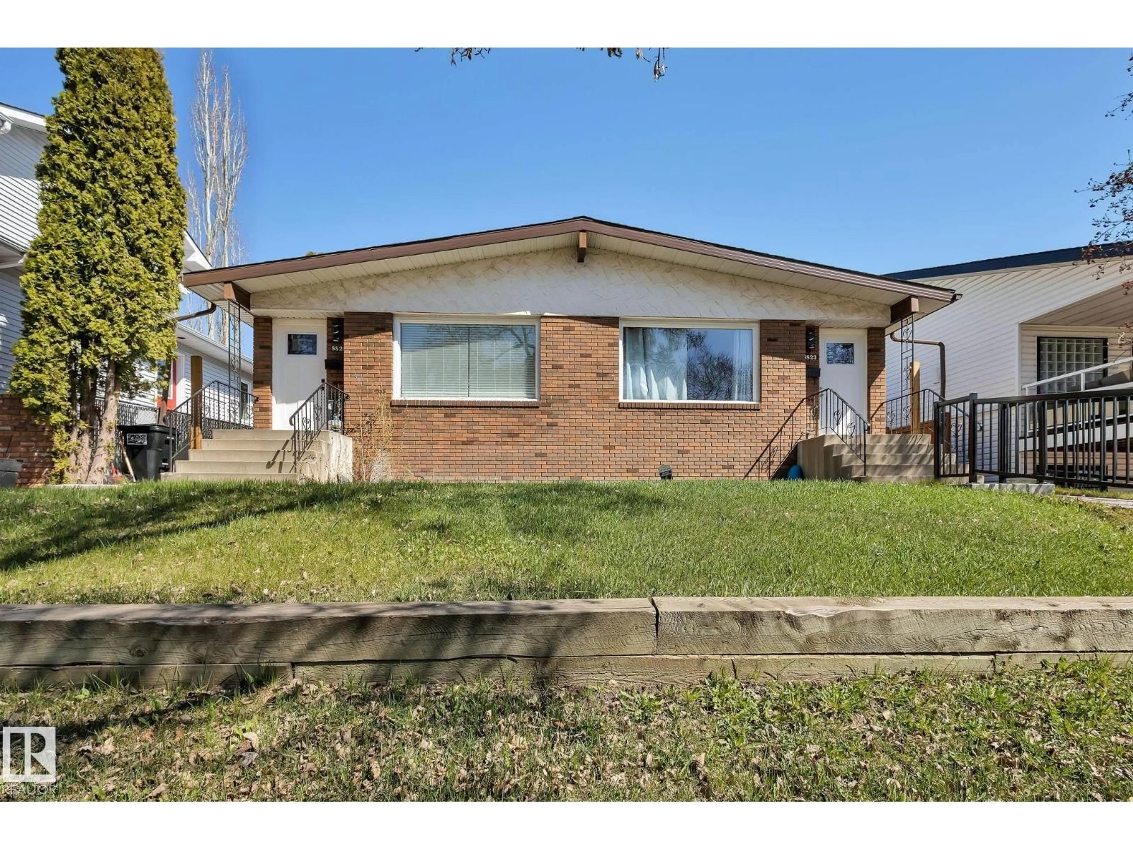 Home with brick exterior material, street for NW - 8823-8825 95 ST, Edmonton Alberta T6C3W6