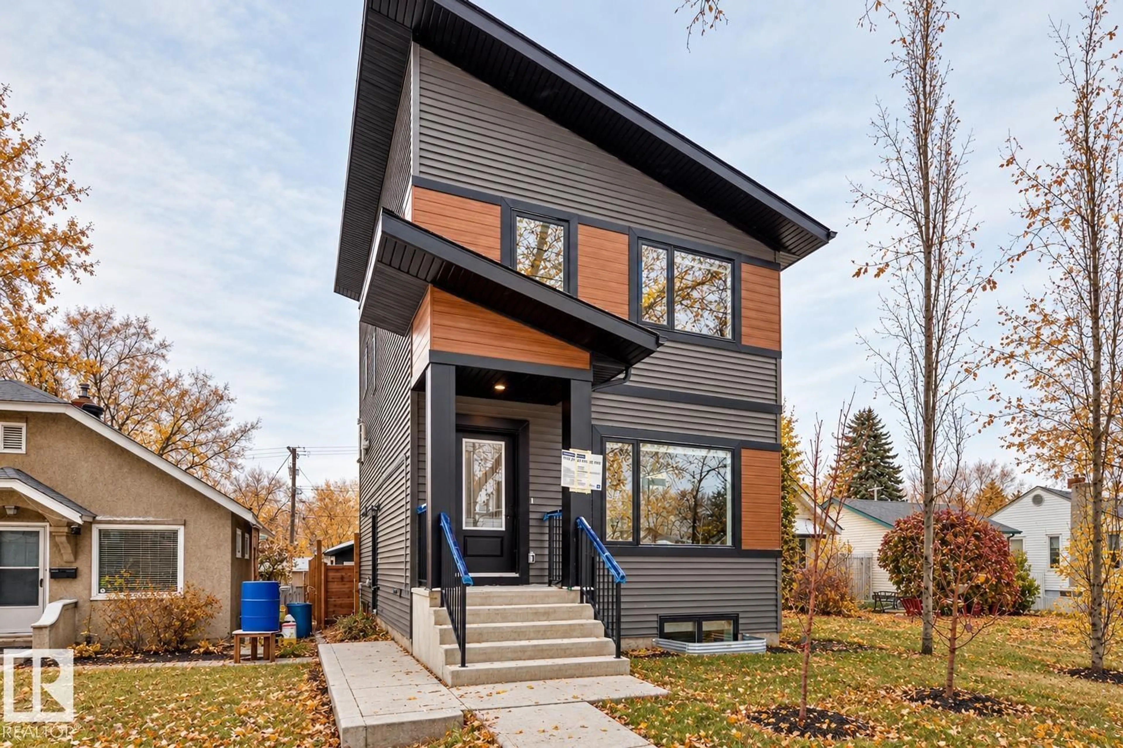 Home with brick exterior material, street for 11519 & 11521 67 ST NW, Edmonton Alberta T5B1L6