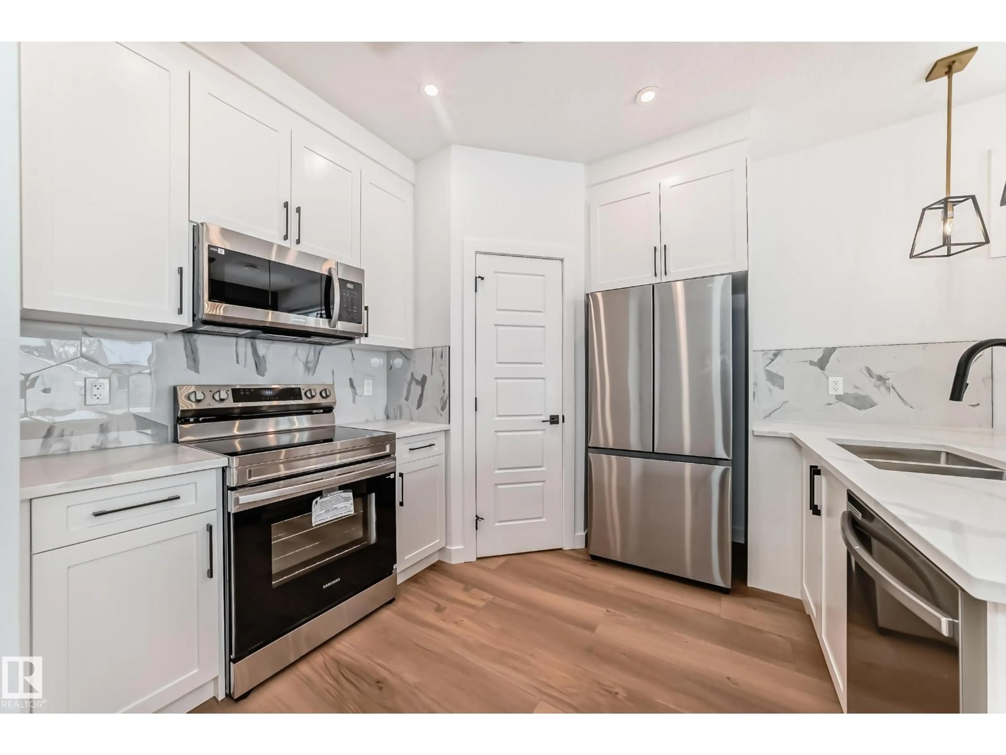 Open concept kitchen, unknown for 11519 & 11521 67 ST NW, Edmonton Alberta T5B1L6