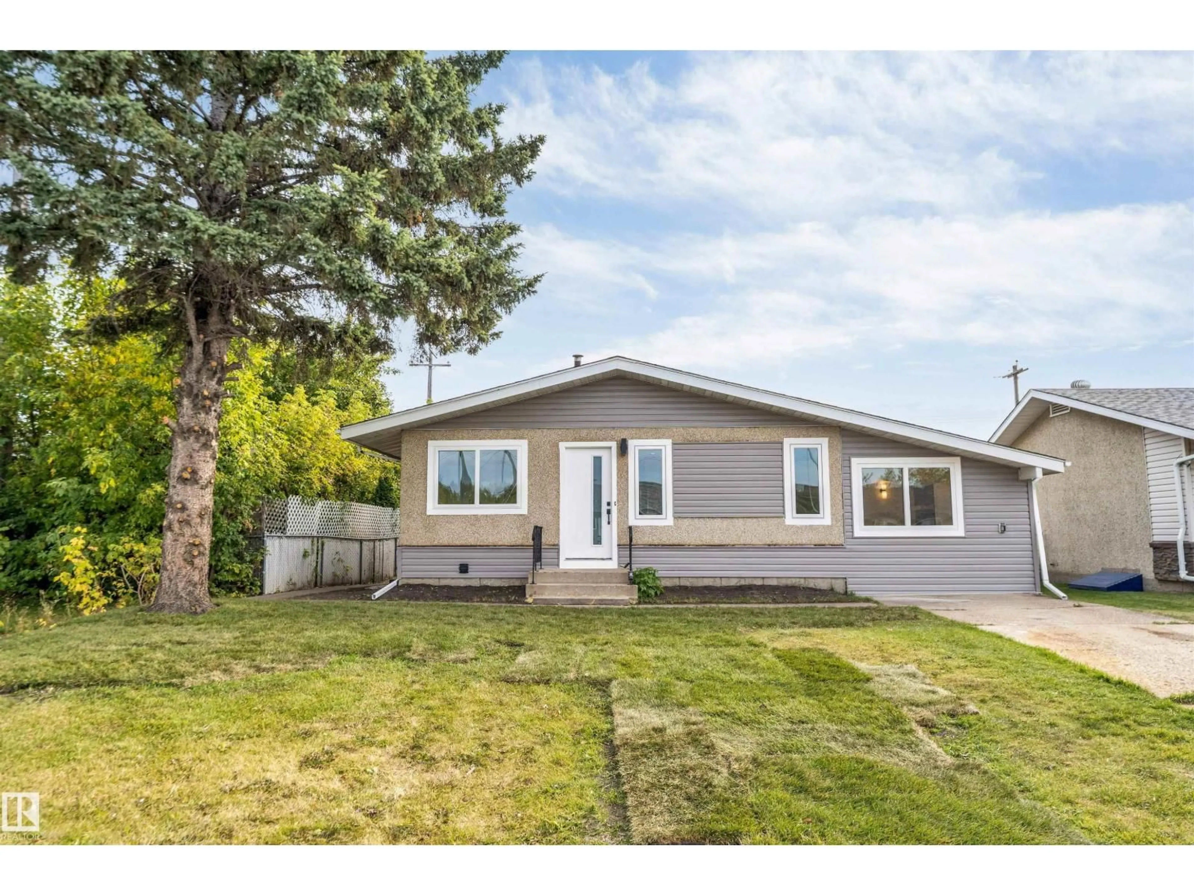 Home with vinyl exterior material, street for NW - 12811 135 ST, Edmonton Alberta T5I1Y3