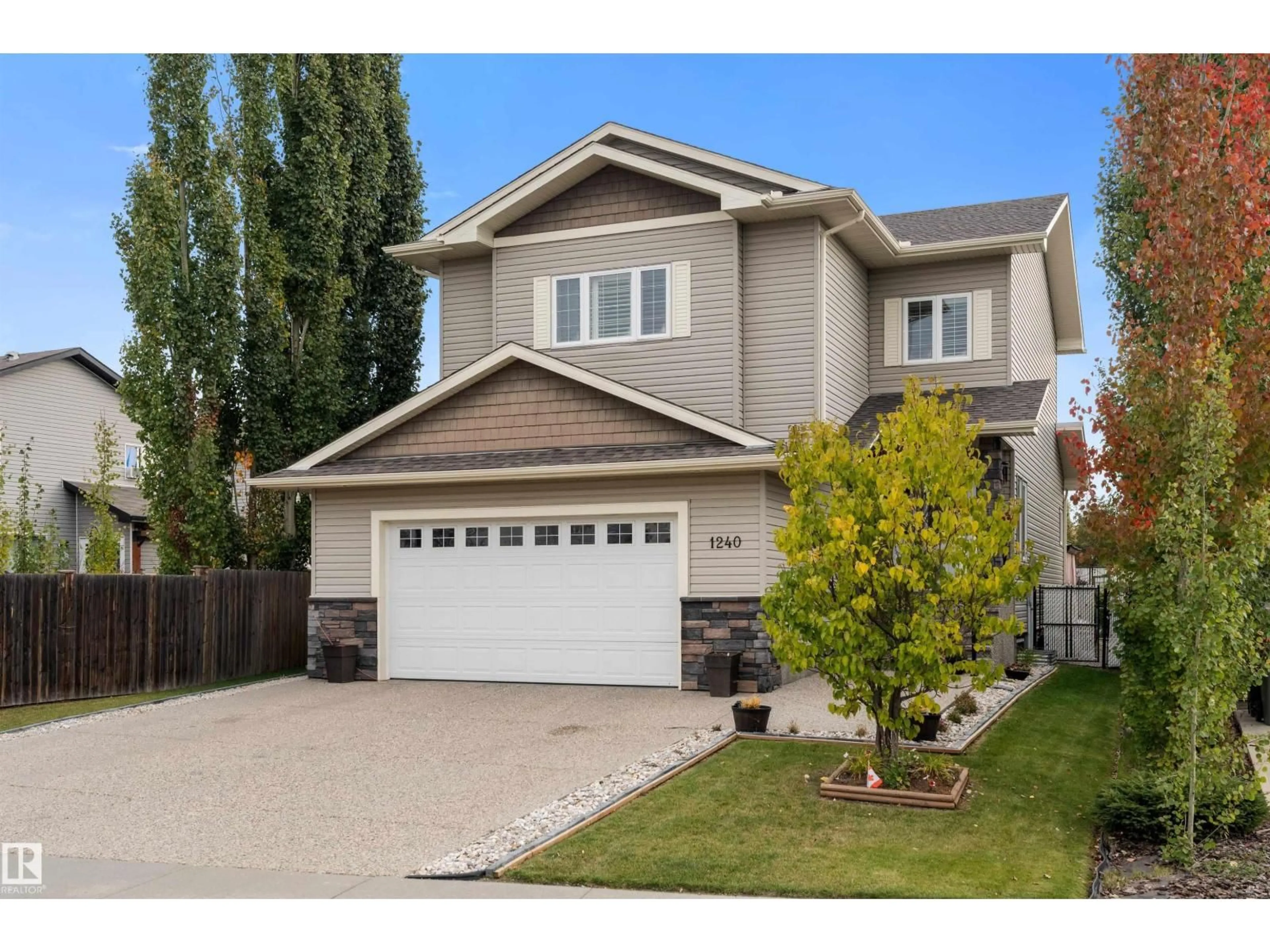 Home with vinyl exterior material, street for 1240 WESTERRA CR, Stony Plain Alberta T7Z0B2