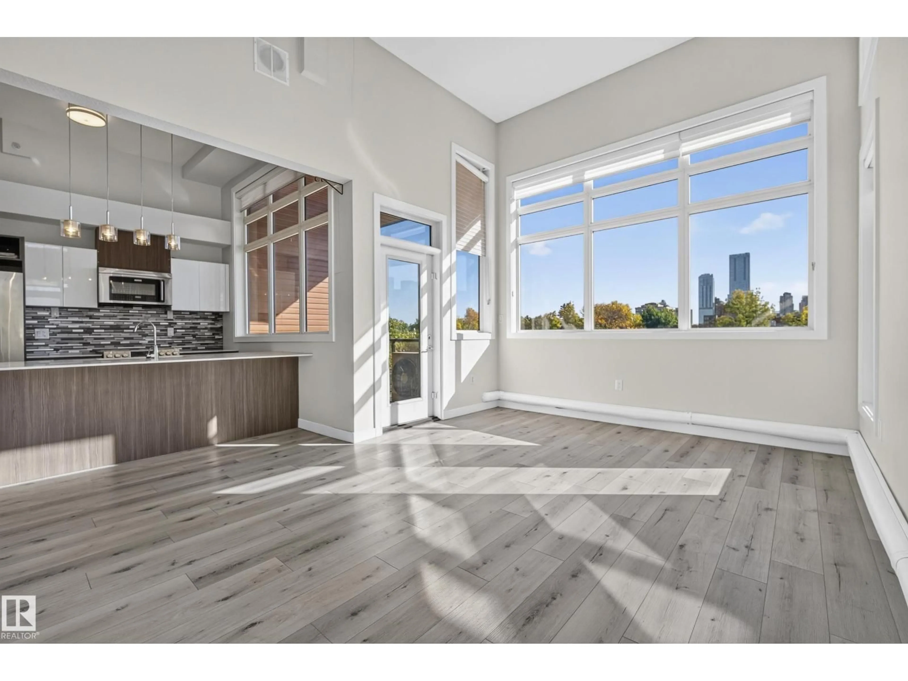 Open concept kitchen, wood/laminate floor for 405 - 10227 115 ST NW, Edmonton Alberta T5K1T7