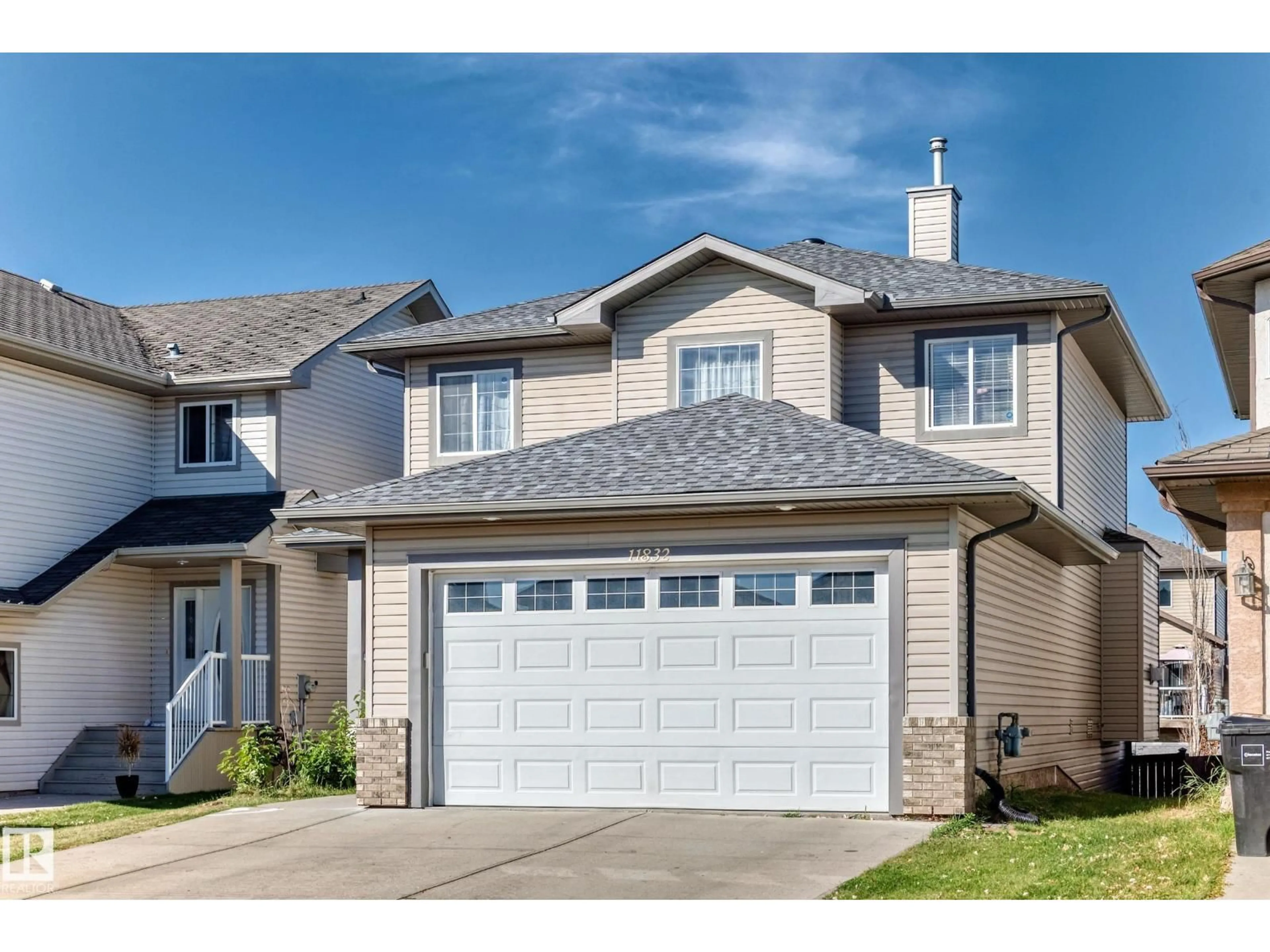 Home with vinyl exterior material, street for 11832 173 AV, Edmonton Alberta T5X6G1