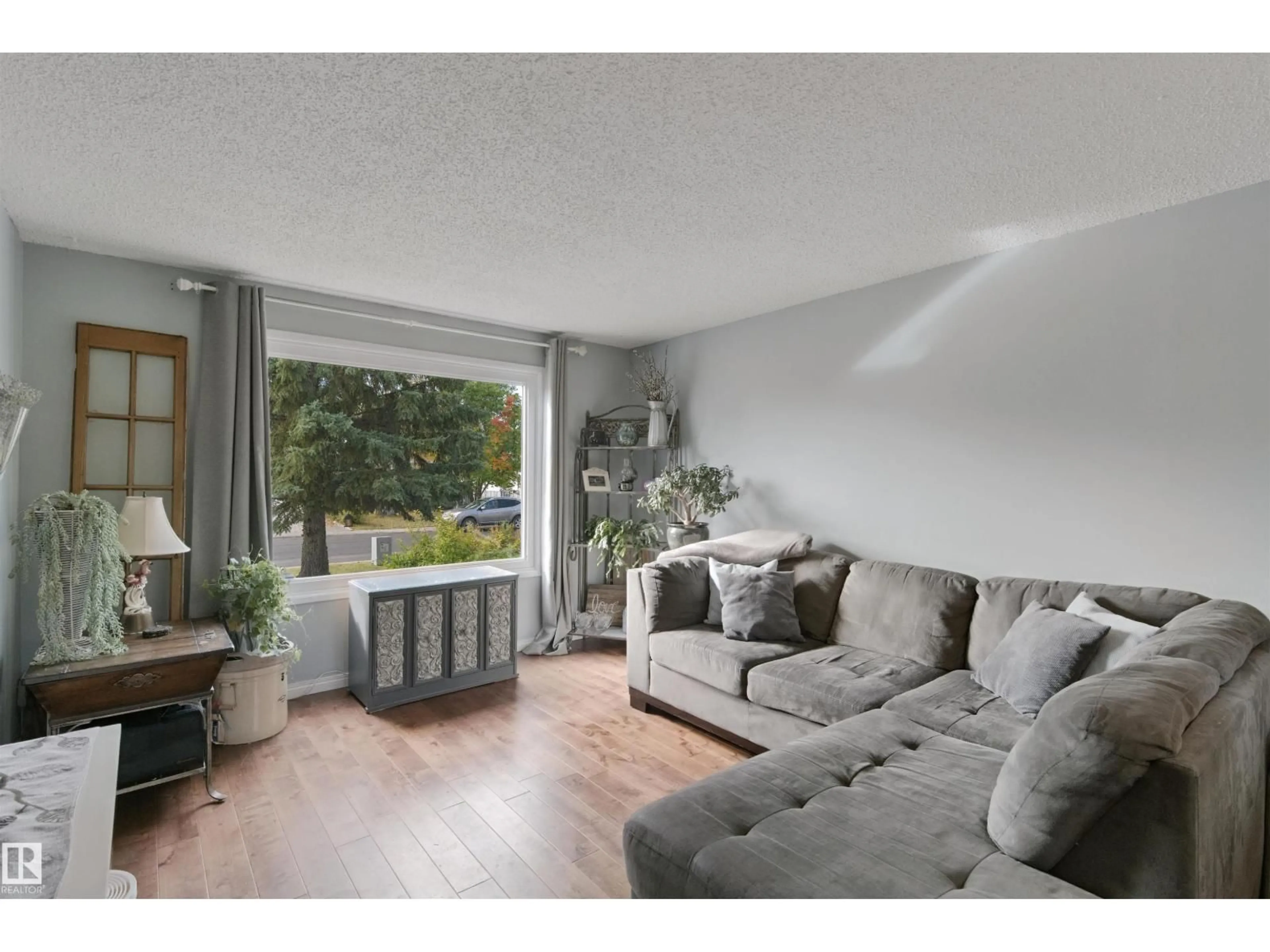 Living room with furniture, unknown for 4528 35 AV, Edmonton Alberta T6L3P9