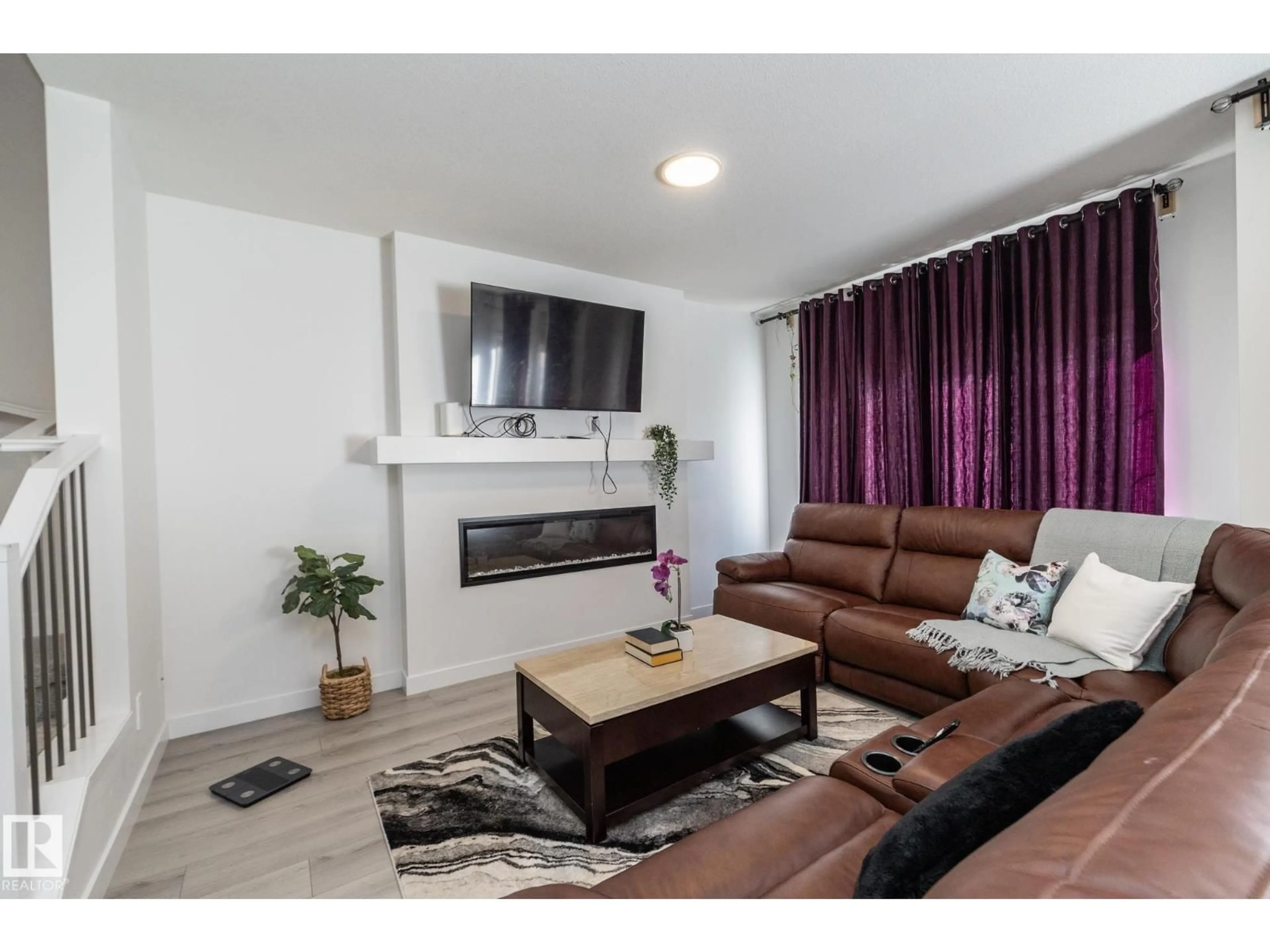 Living room with furniture, wood/laminate floor for NW - 3608 214 ST, Edmonton Alberta T6M1S3