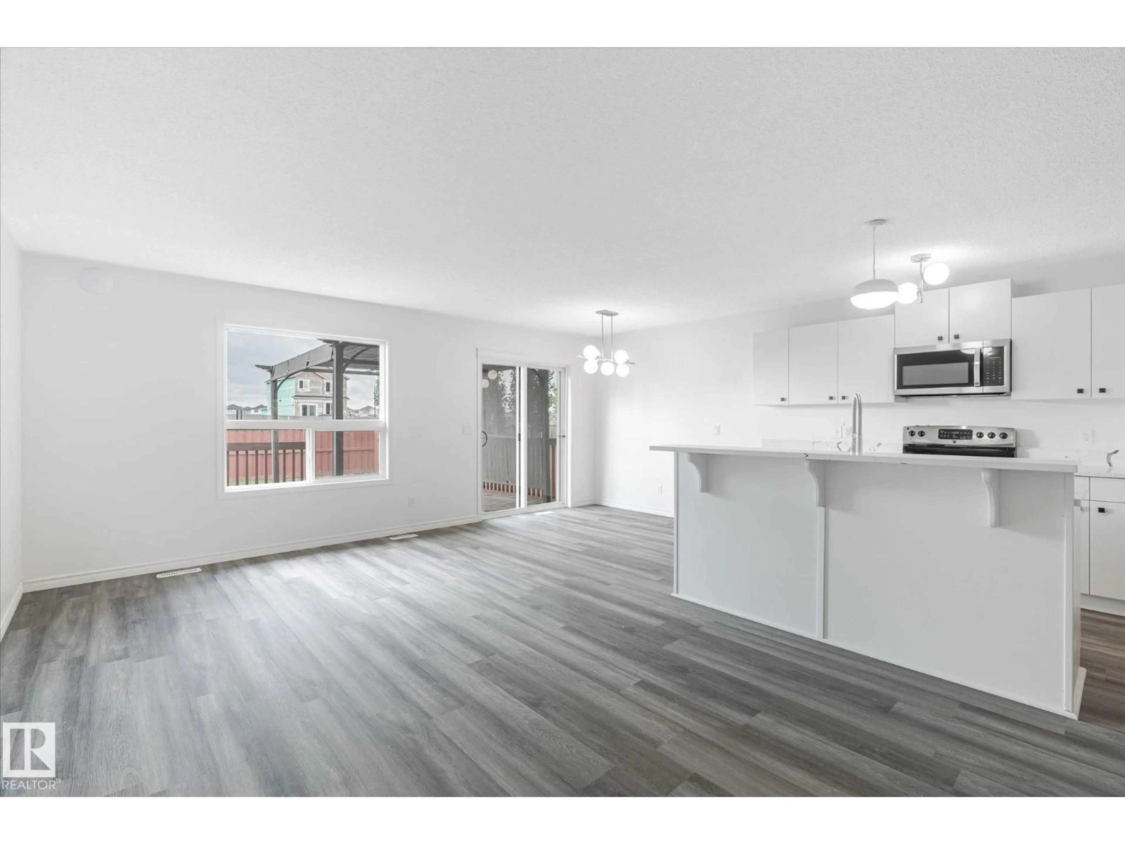 Open concept kitchen, wood/laminate floor for 42 CATALINA CO, Fort Saskatchewan Alberta T8L0K5