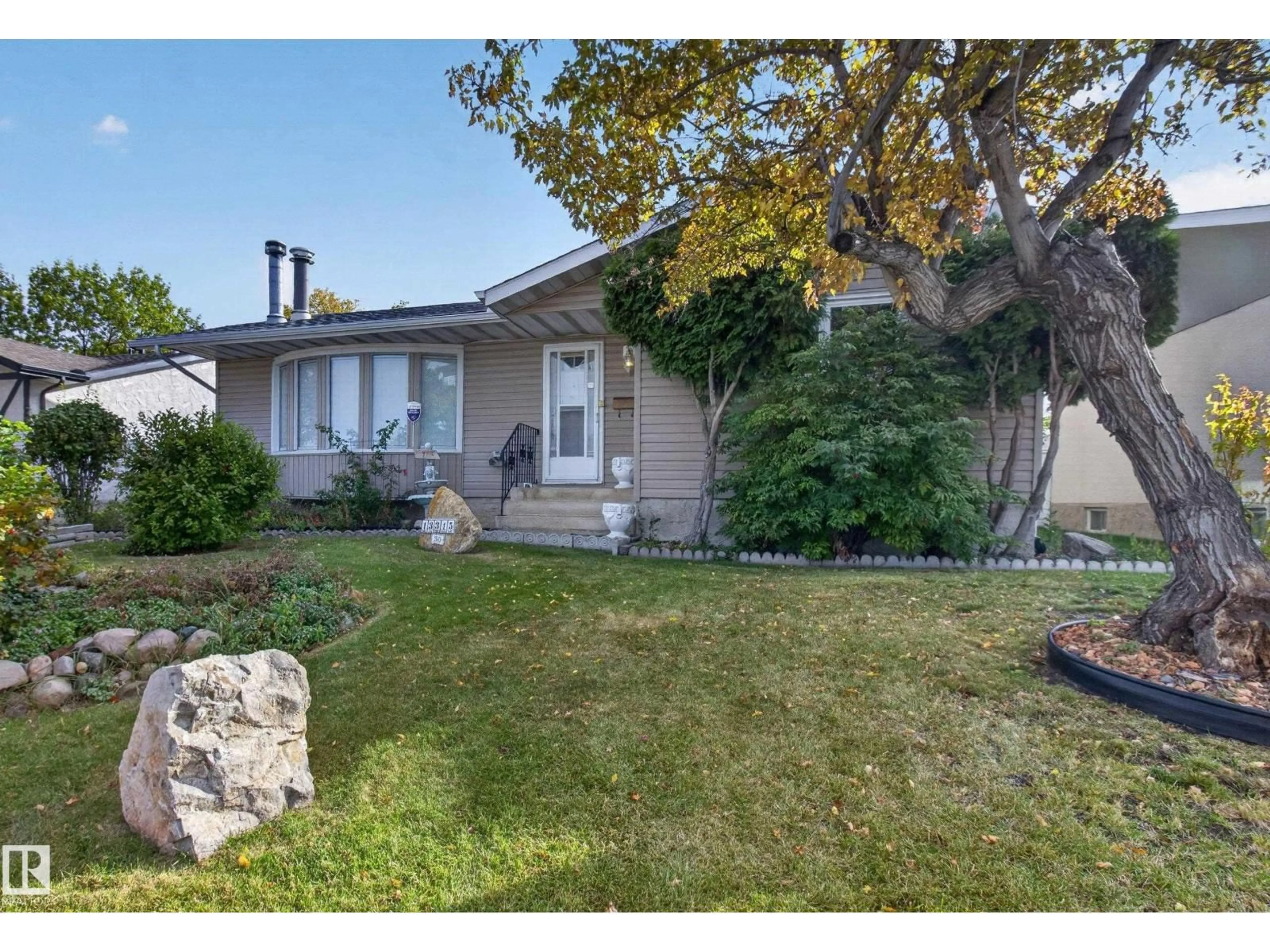 Home with vinyl exterior material, street for 13315 30 ST, Edmonton Alberta T5A3A1