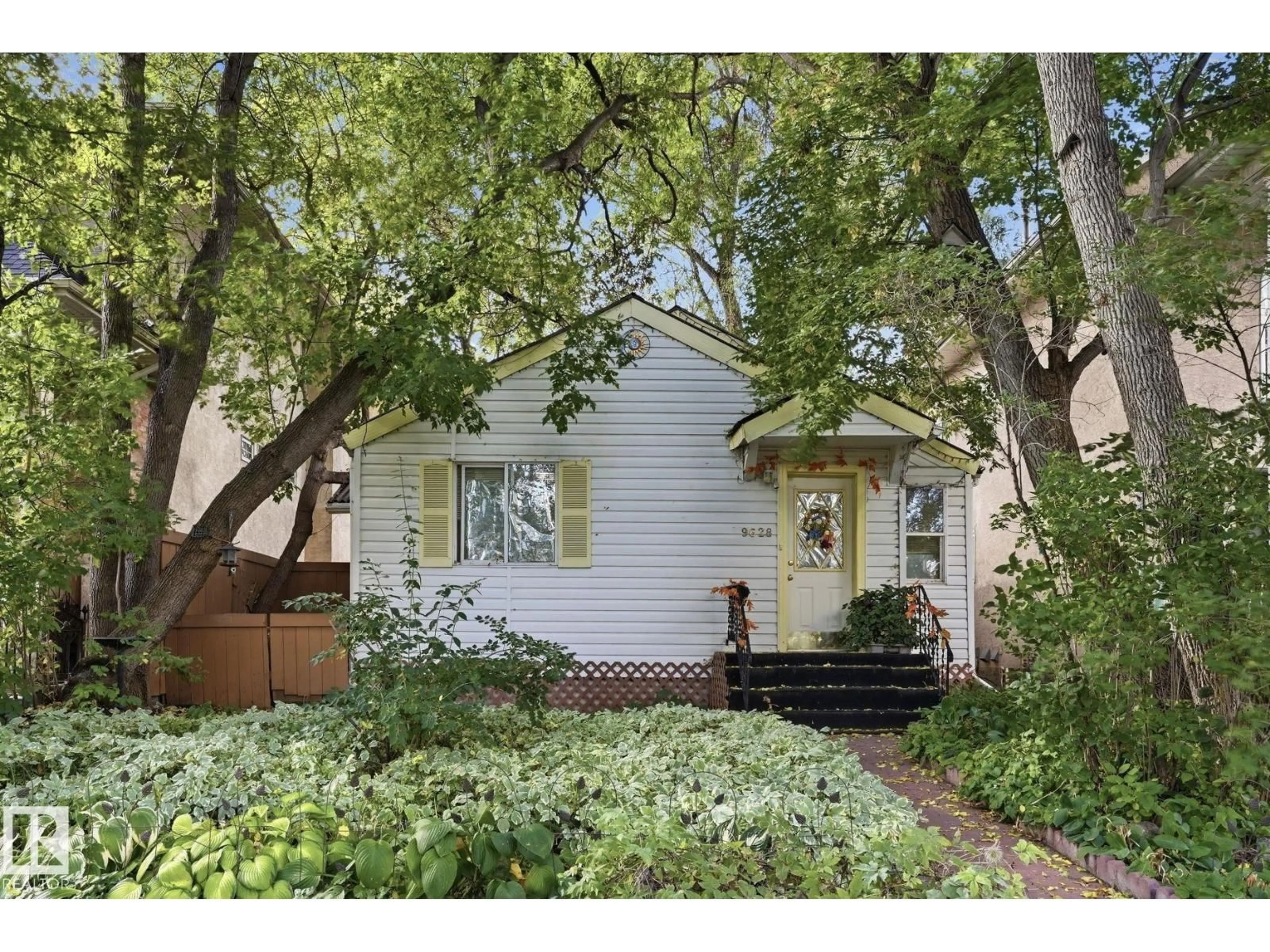 Home with vinyl exterior material, street for NW - 9628 100A ST, Edmonton Alberta T5K0V8
