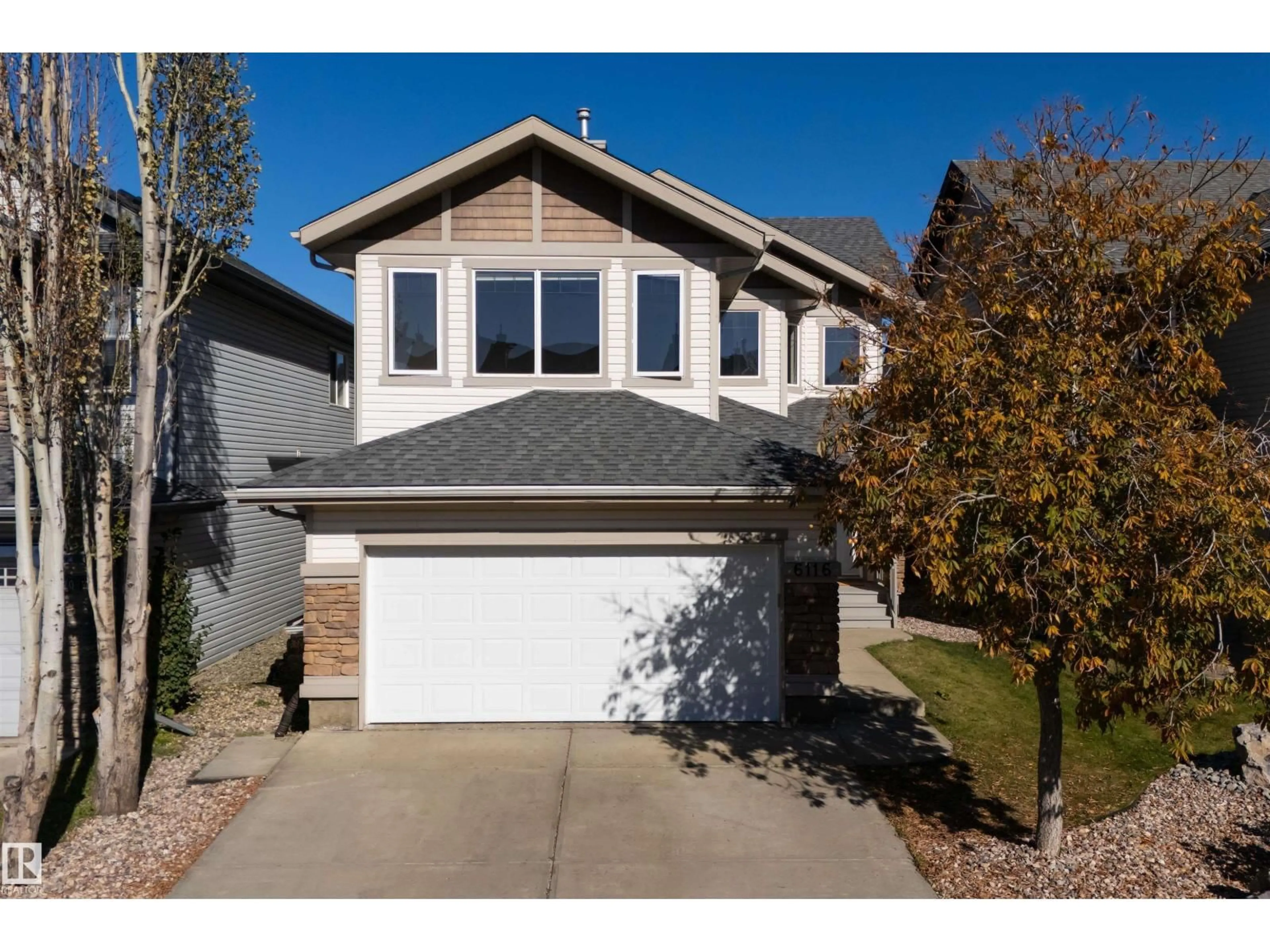 Home with vinyl exterior material, street for 6116 8 AV, Edmonton Alberta T6X0G3