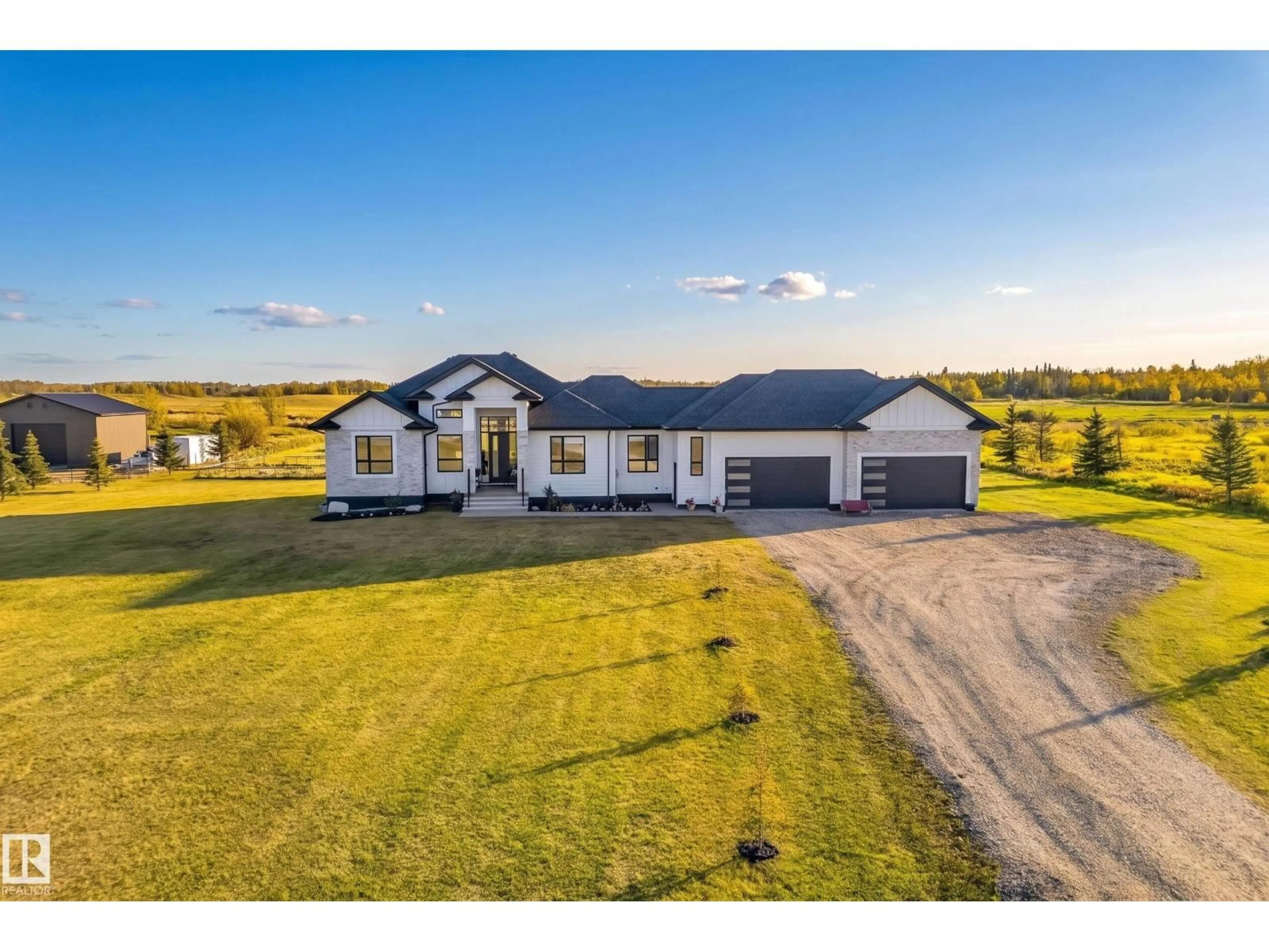 A pic from outside/outdoor area/front of a property/back of a property/a pic from drone, building for 70 50509 RGE RD 222, Rural Leduc County Alberta T0B3M2