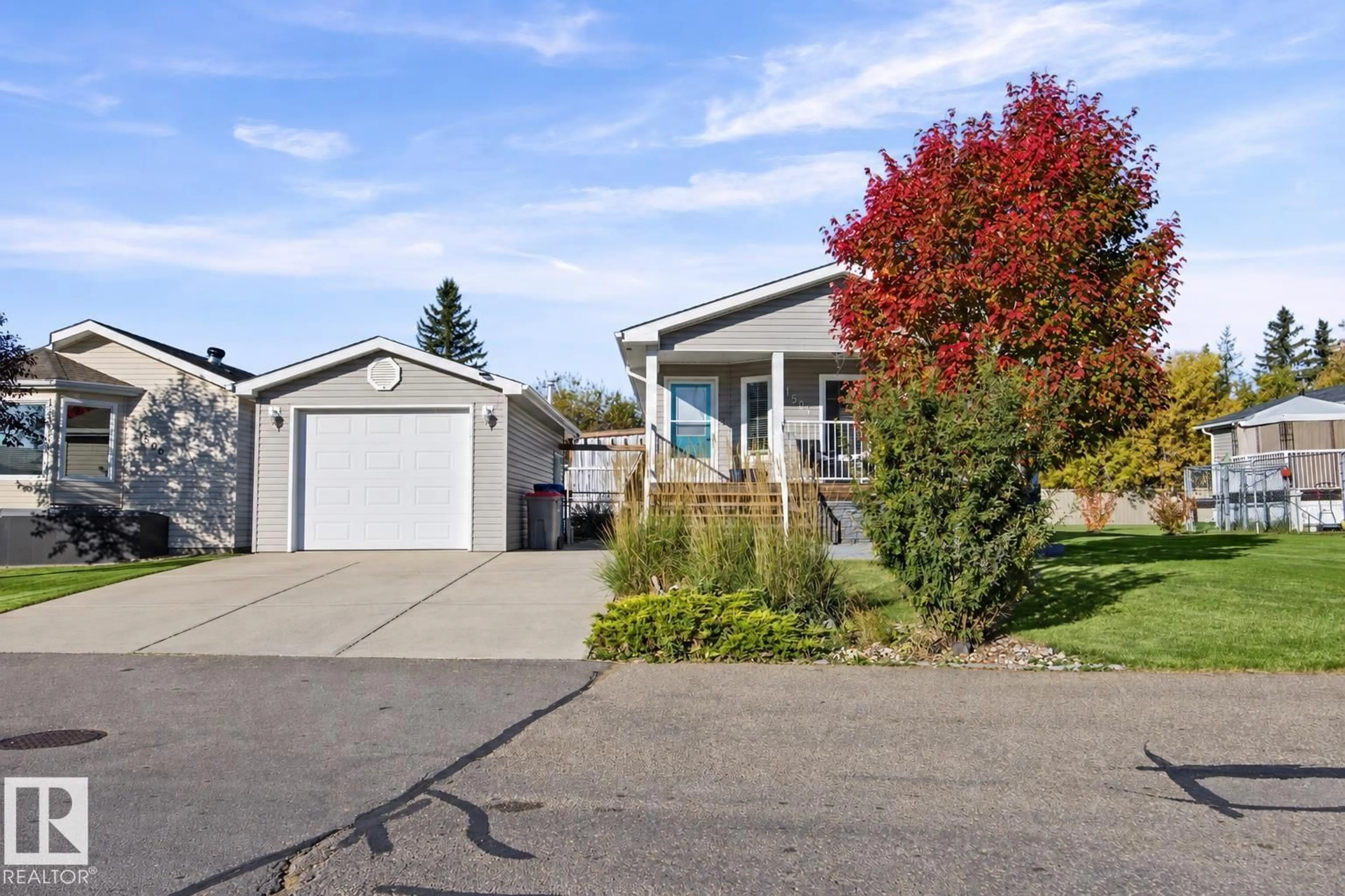 Home with vinyl exterior material, street for 1504 RANGE ROAD 272 ROAD, Rural Parkland County Alberta T7X4M4
