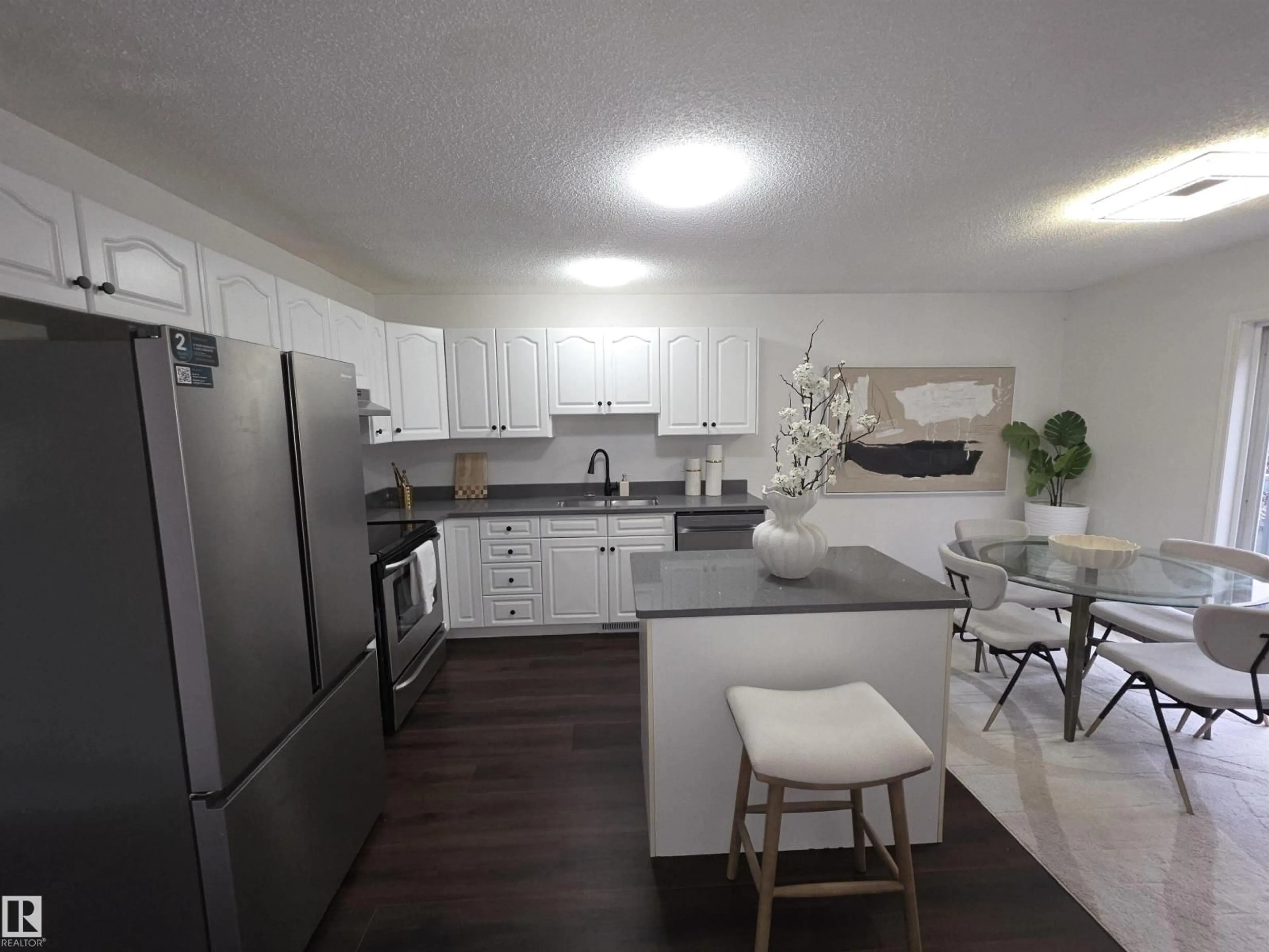 Open concept kitchen, unknown for #6 - 16777 91 ST, Edmonton Alberta T5Z3X4