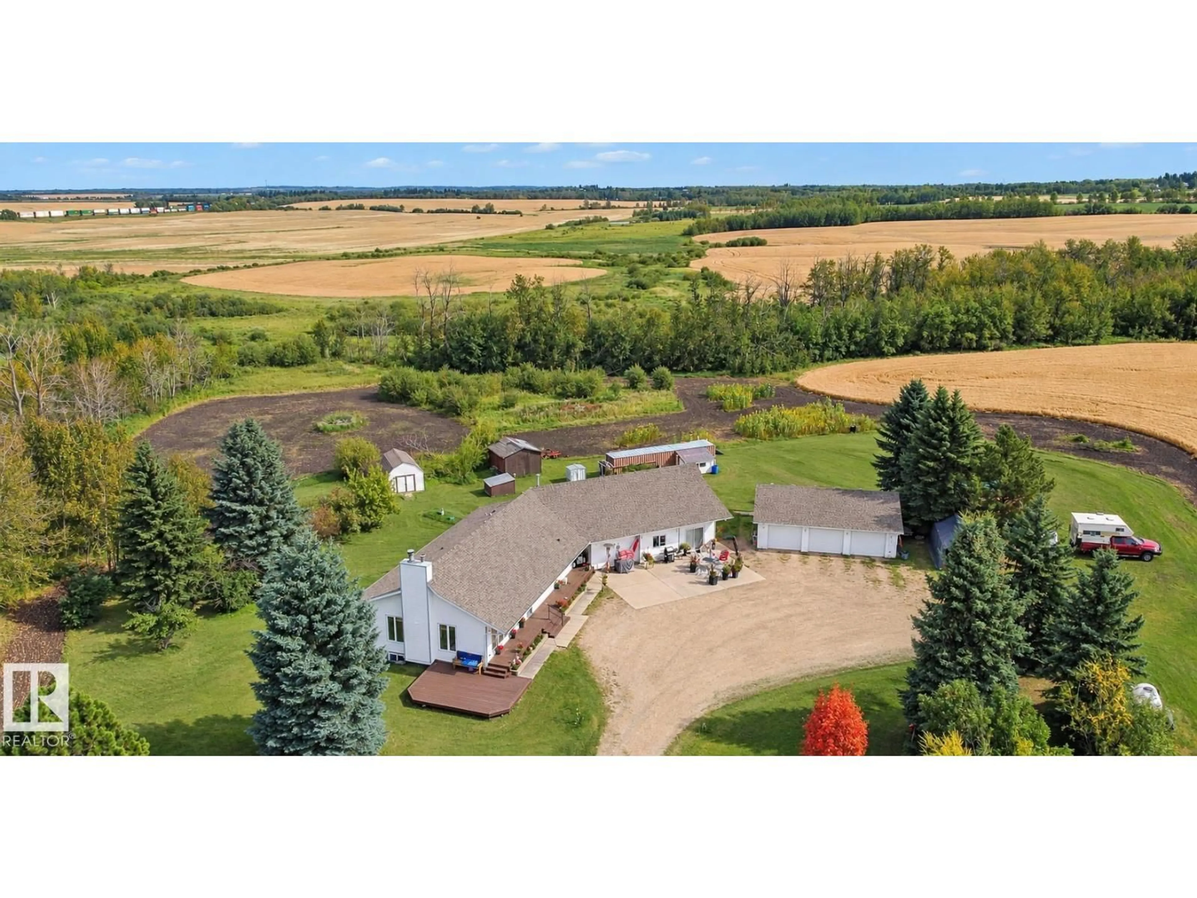 A pic from outside/outdoor area/front of a property/back of a property/a pic from drone, water/lake/river/ocean view for 53027 RGE ROAD 225, Rural Strathcona County Alberta T8A4T7