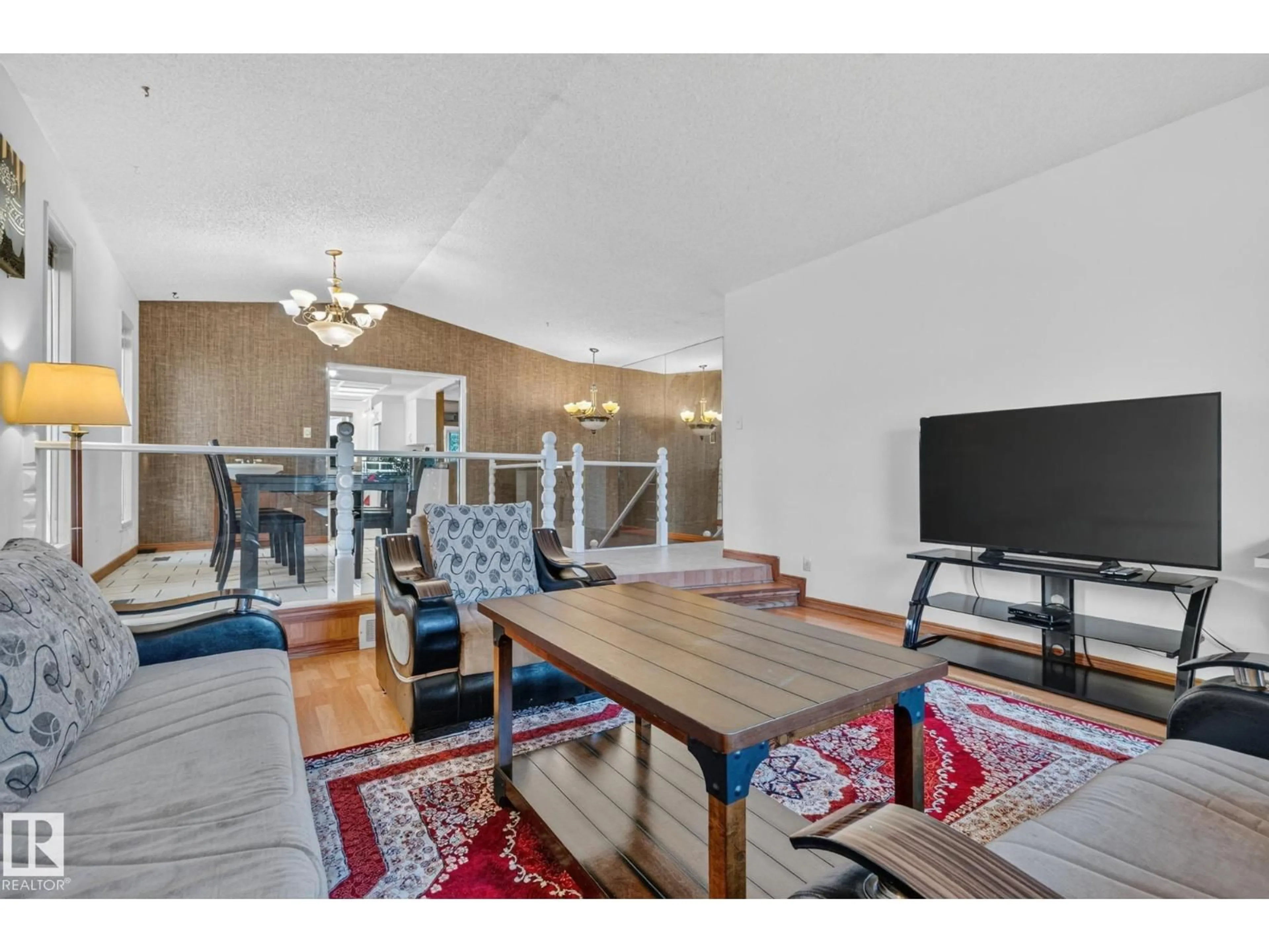 Living room with furniture, wood/laminate floor for 11 HOWSON CR, Edmonton Alberta T5A4T7