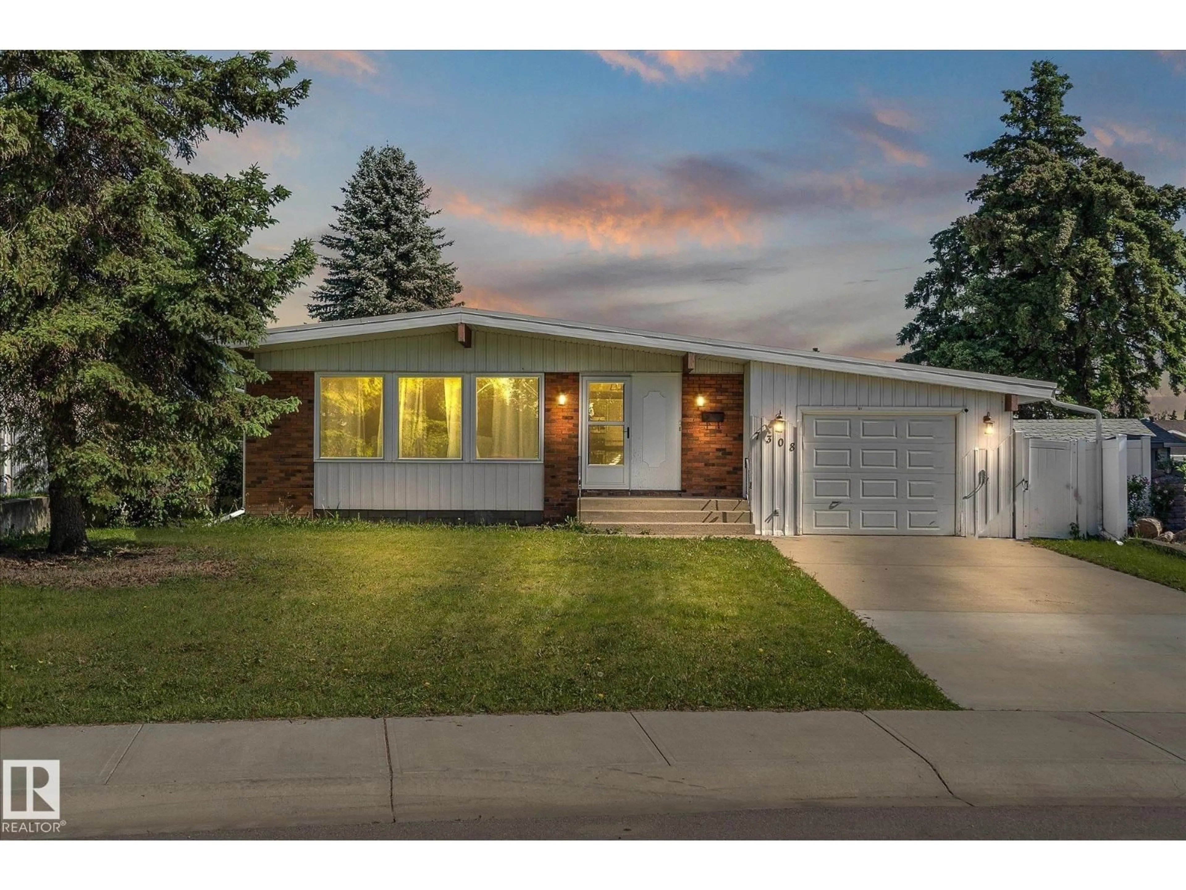 Home with vinyl exterior material, street for 7308 149 AV, Edmonton Alberta T5C2V4