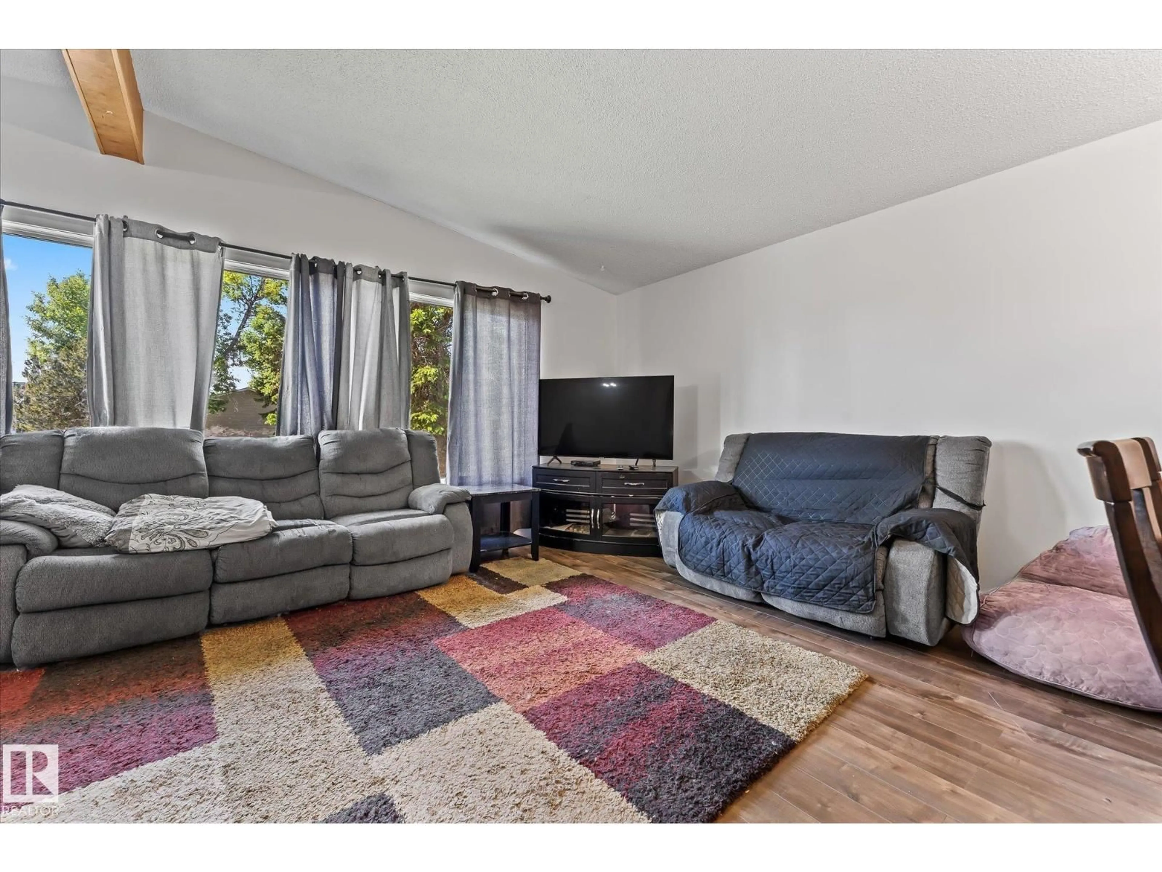 Living room with furniture, unknown for 7308 149 AV, Edmonton Alberta T5C2V4