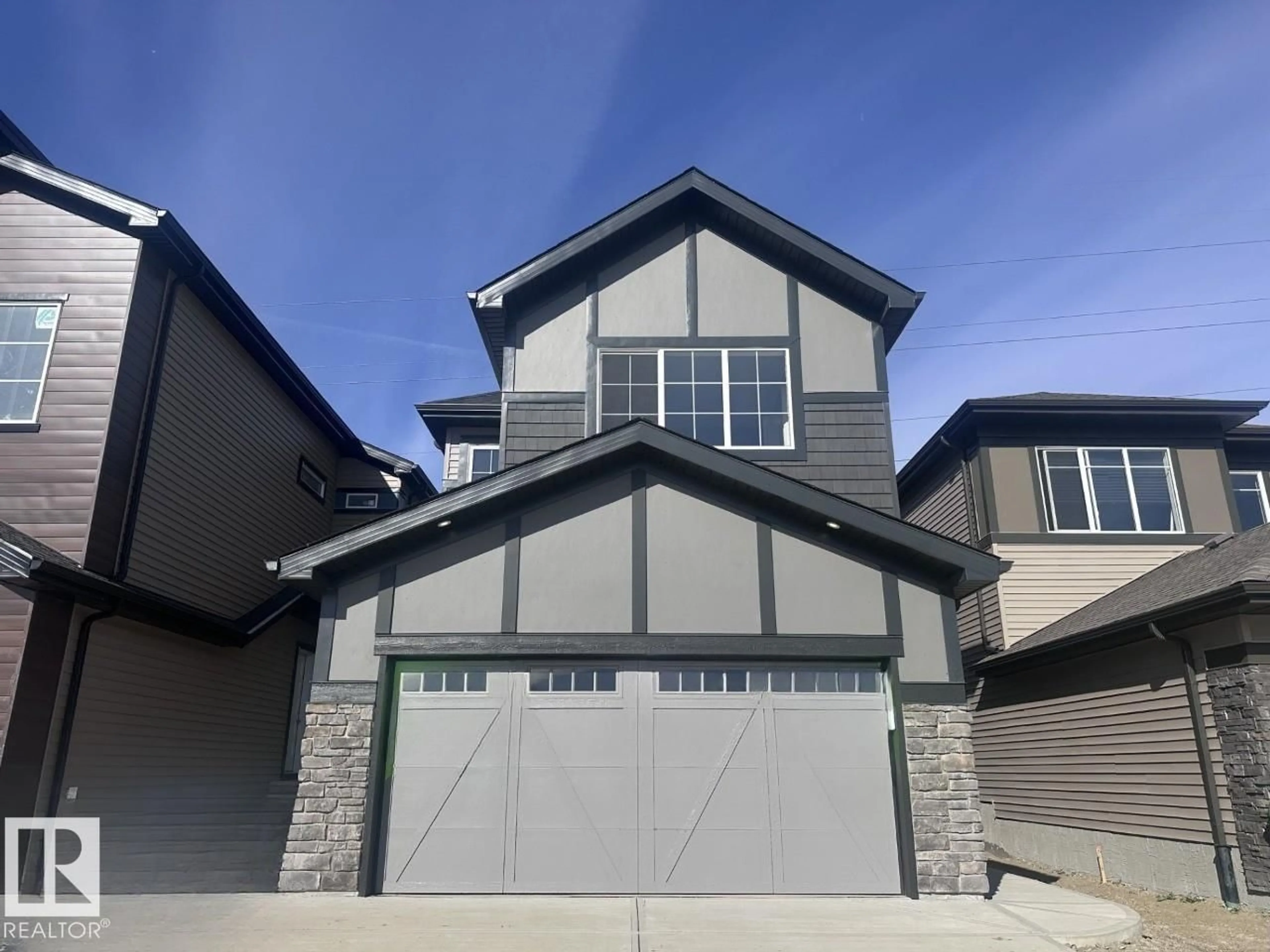 Home with vinyl exterior material, street for NW - 17236 5 ST, Edmonton Alberta T5Y6G4