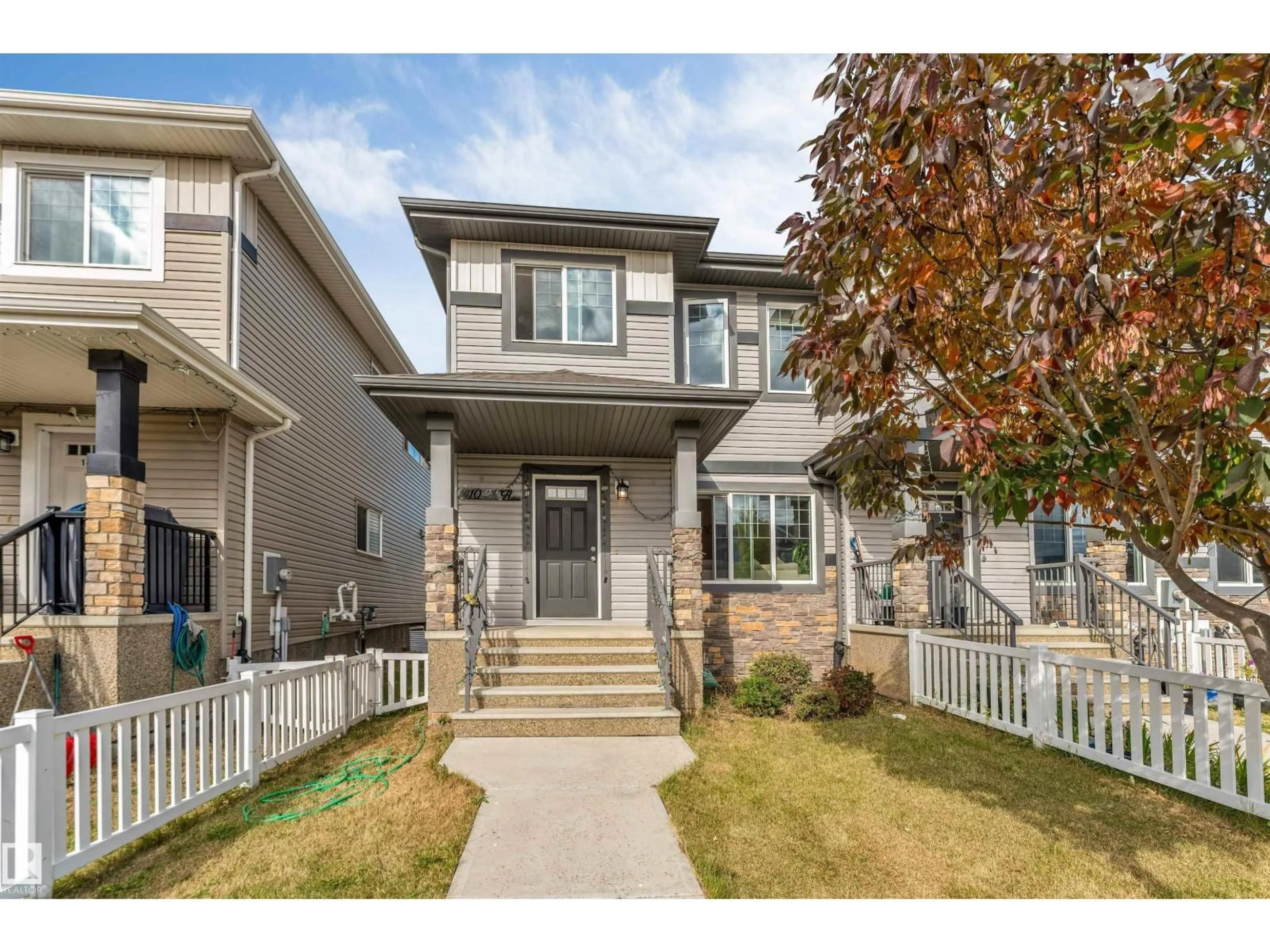 Home with vinyl exterior material, street for 1410 26 AV, Edmonton Alberta T6T0W1