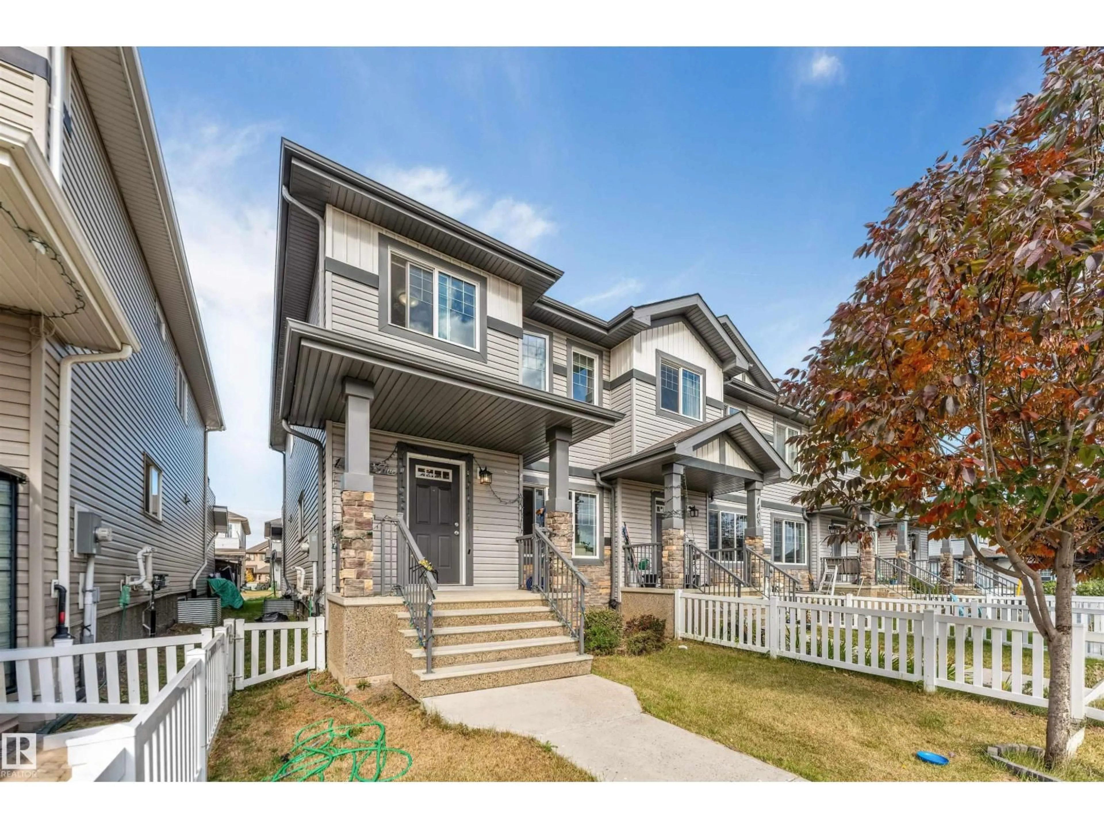 Home with vinyl exterior material, street for 1410 26 AV, Edmonton Alberta T6T0W1