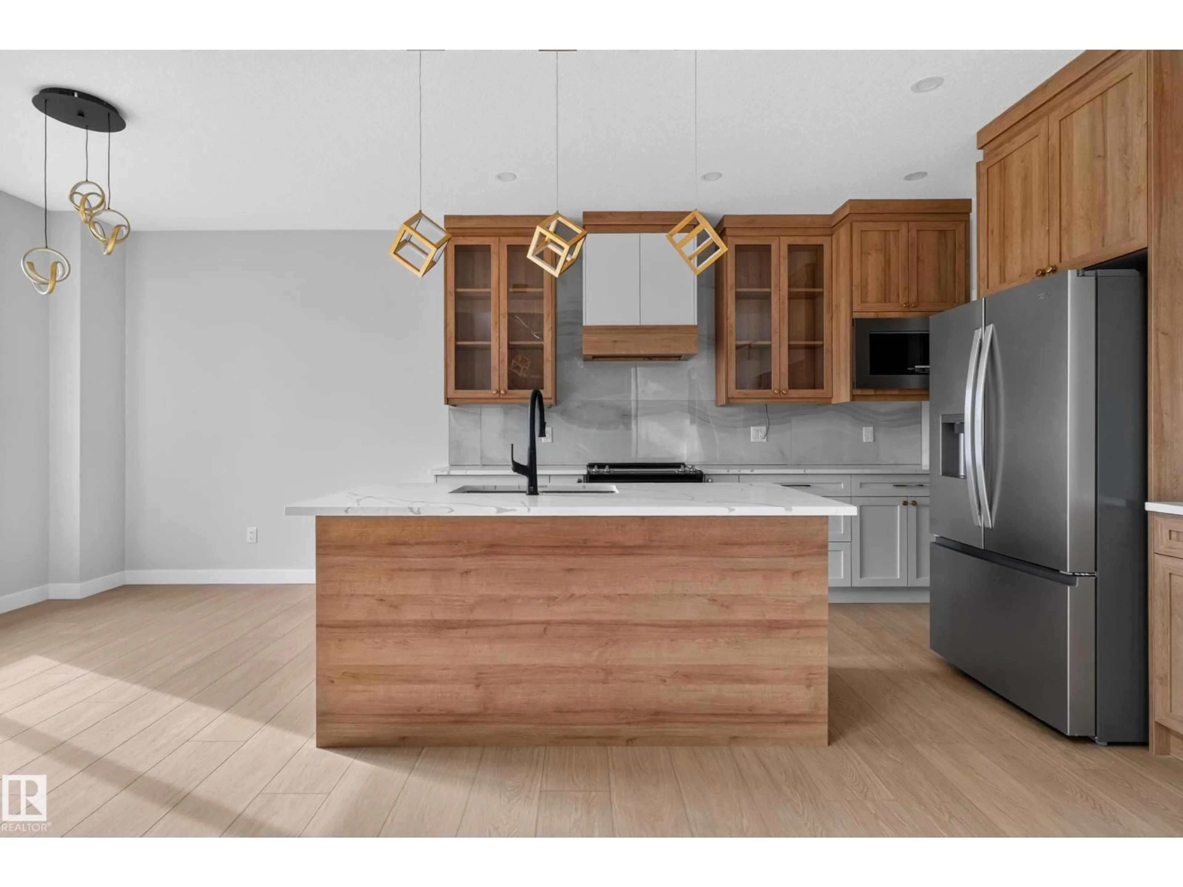 Open concept kitchen, wood/laminate floor for 4 PEBBLE CV, Spruce Grove Alberta T7X4E7