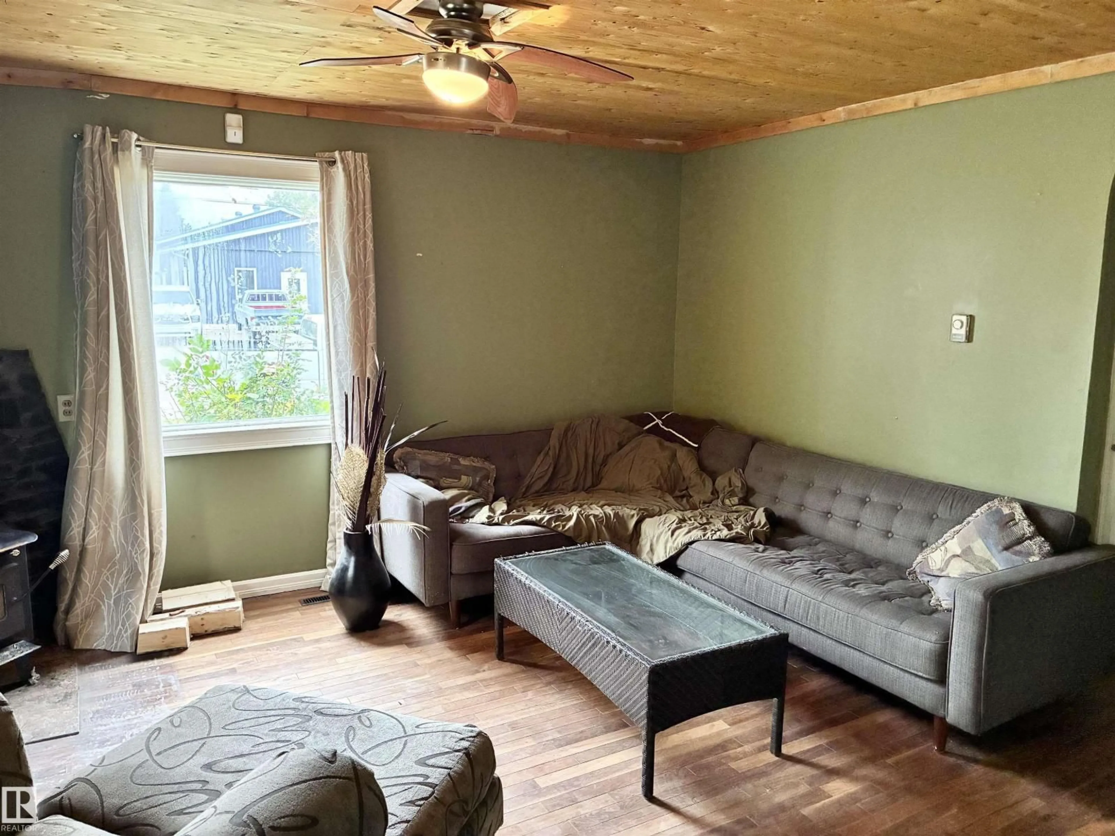 Living room with furniture, wood/laminate floor for 5231 46 ST, Camrose Alberta T4V1H4