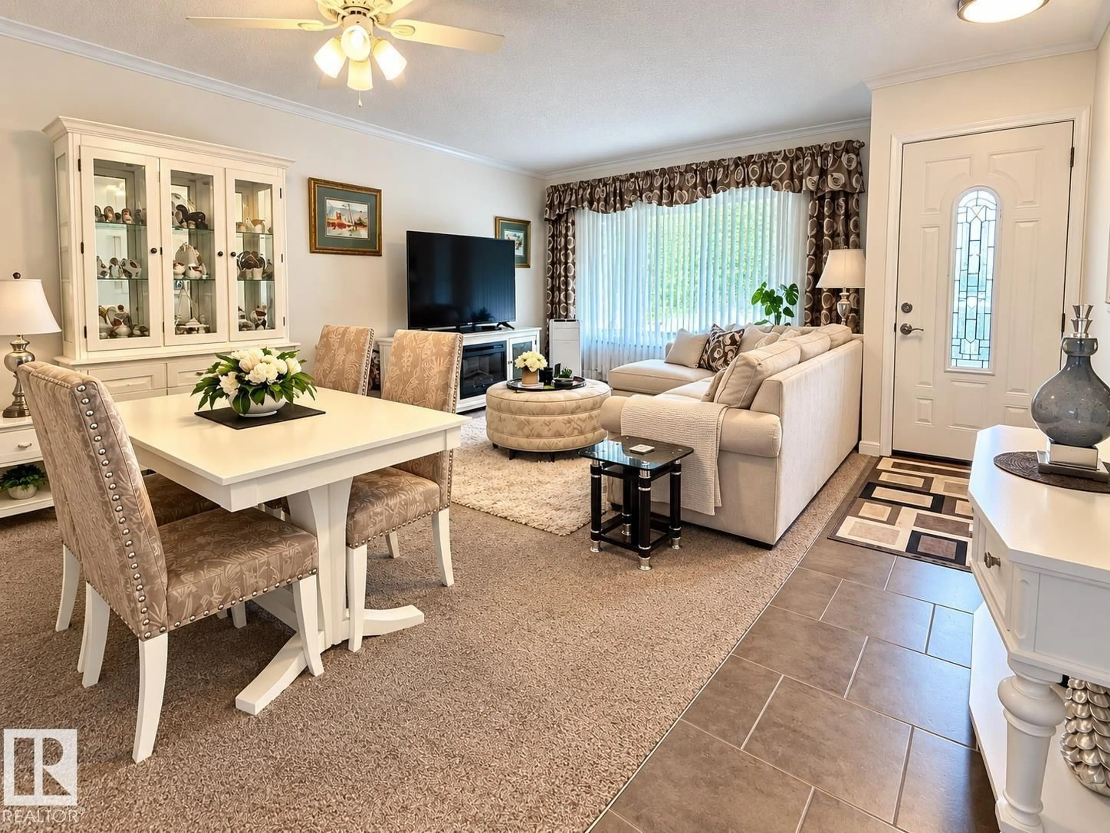 Living room with furniture, ceramic/tile floor for 10315 44 ST, Edmonton Alberta T6A1V6
