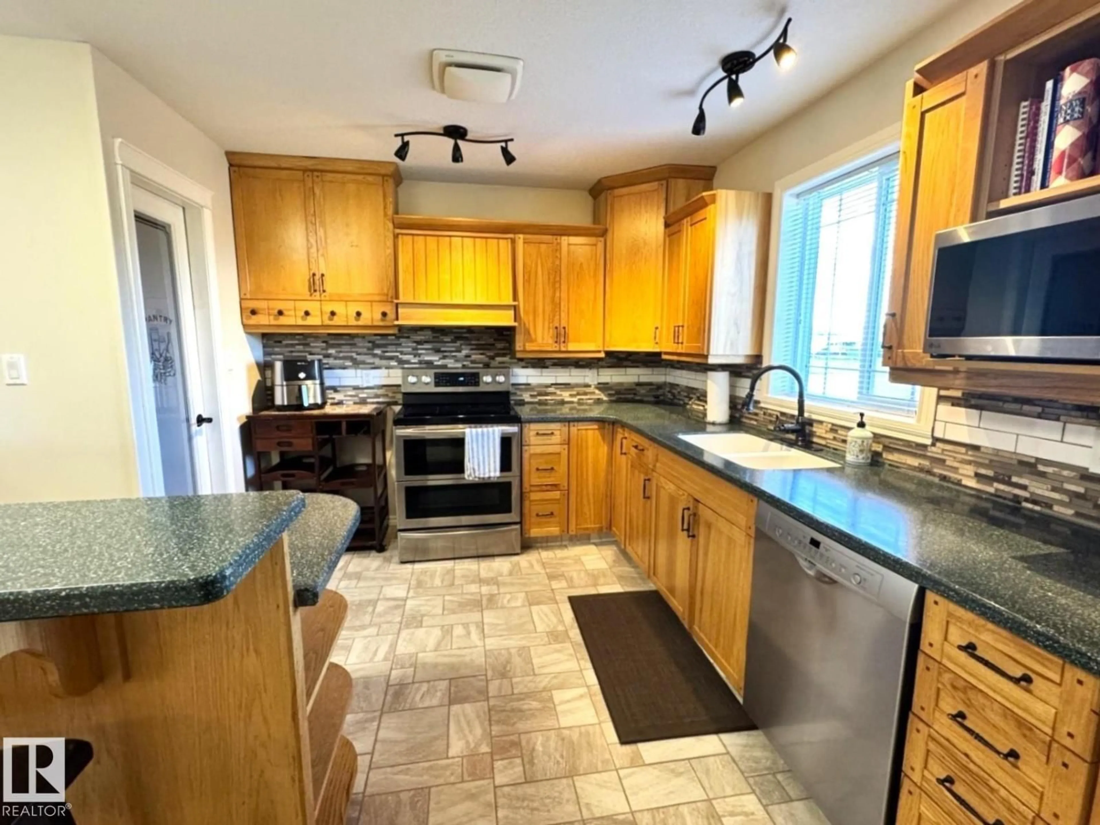 Open concept kitchen, ceramic/tile floor for 4928 50 AVE, Entwistle Alberta T0E0S0