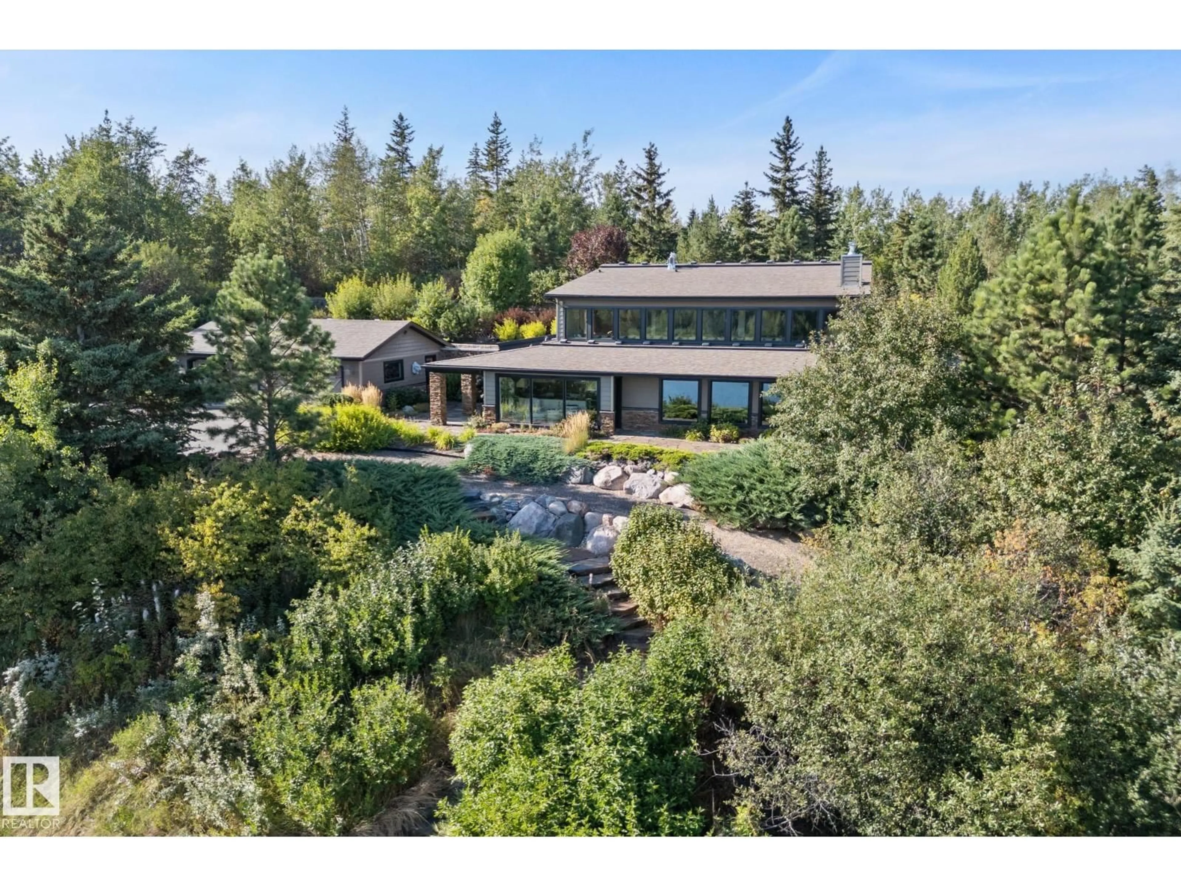 A pic from outside/outdoor area/front of a property/back of a property/a pic from drone, forest/trees view for 51109 RGE ROAD 210, Rural Strathcona County Alberta T8G1E6